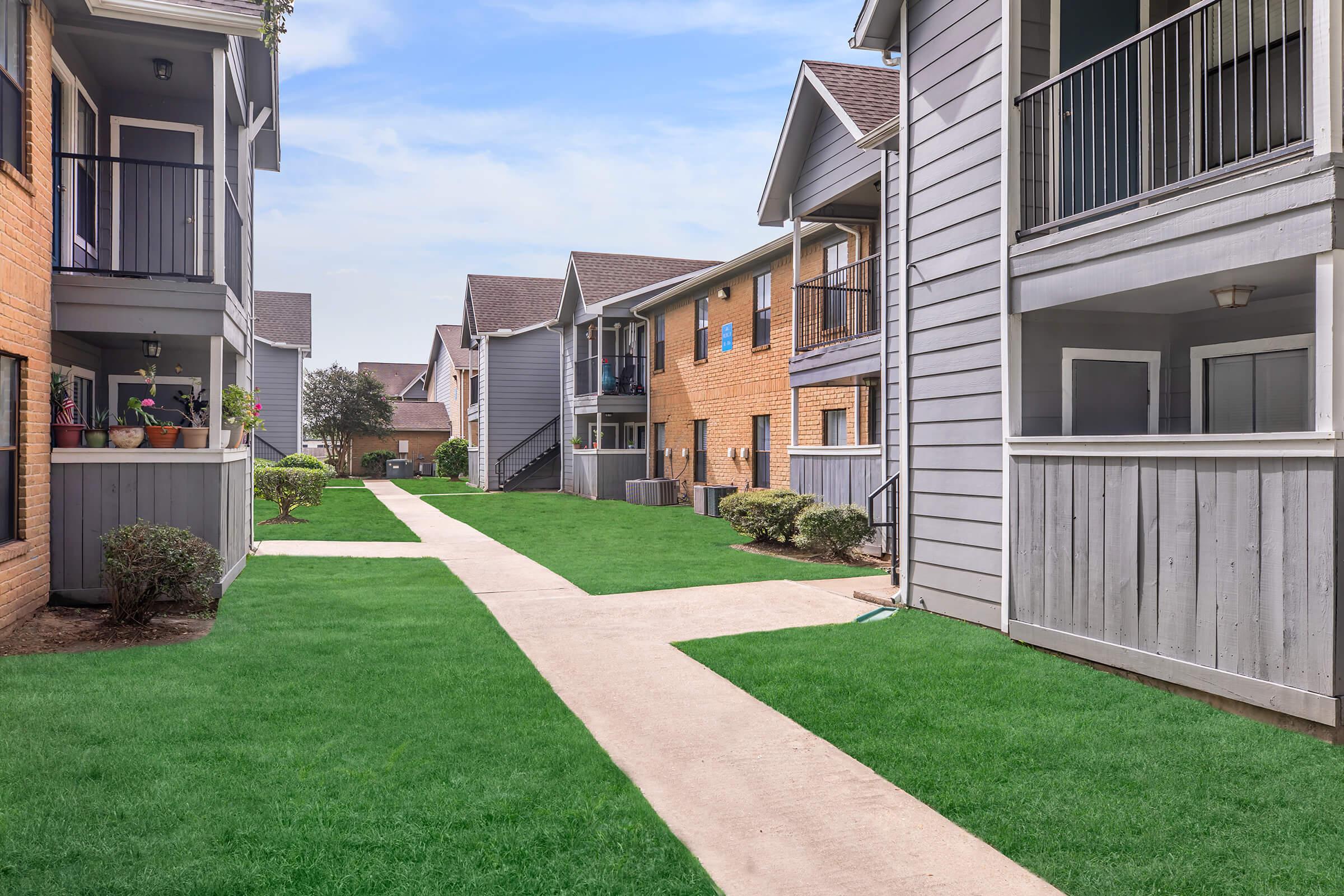 a large lawn in front of a building