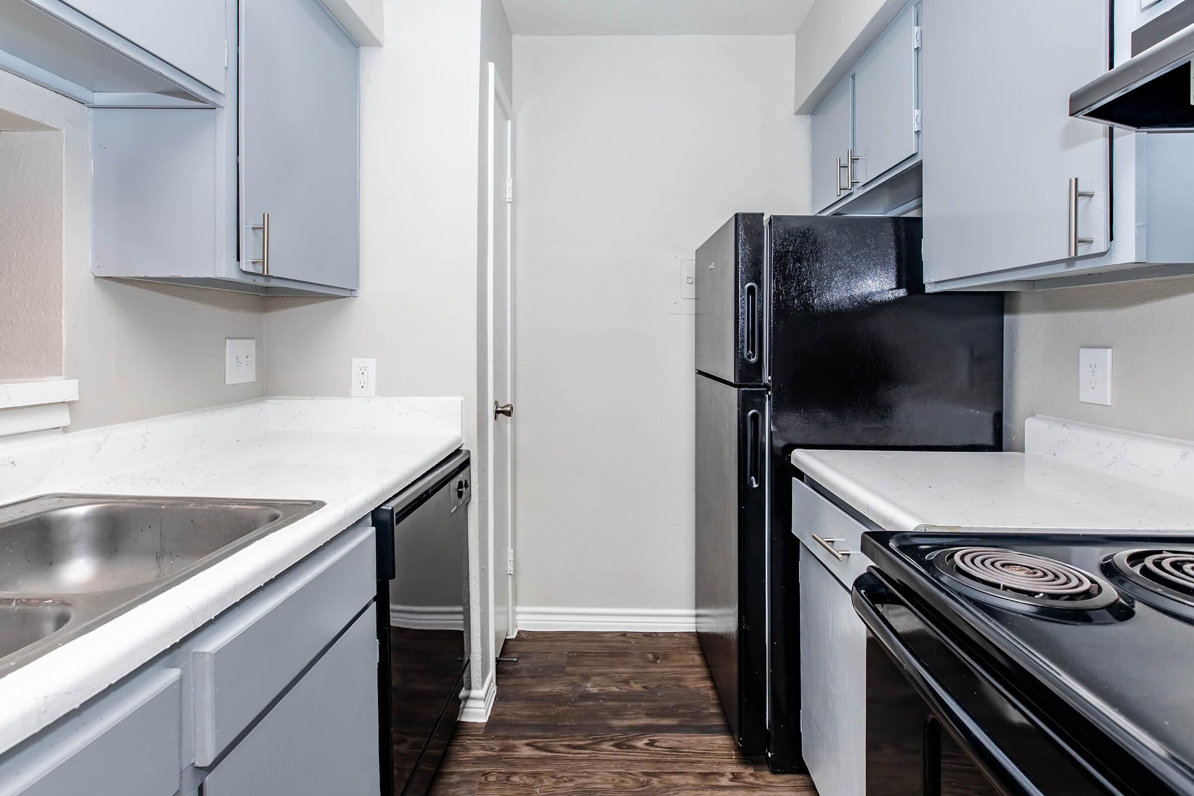 a kitchen with a stove top oven