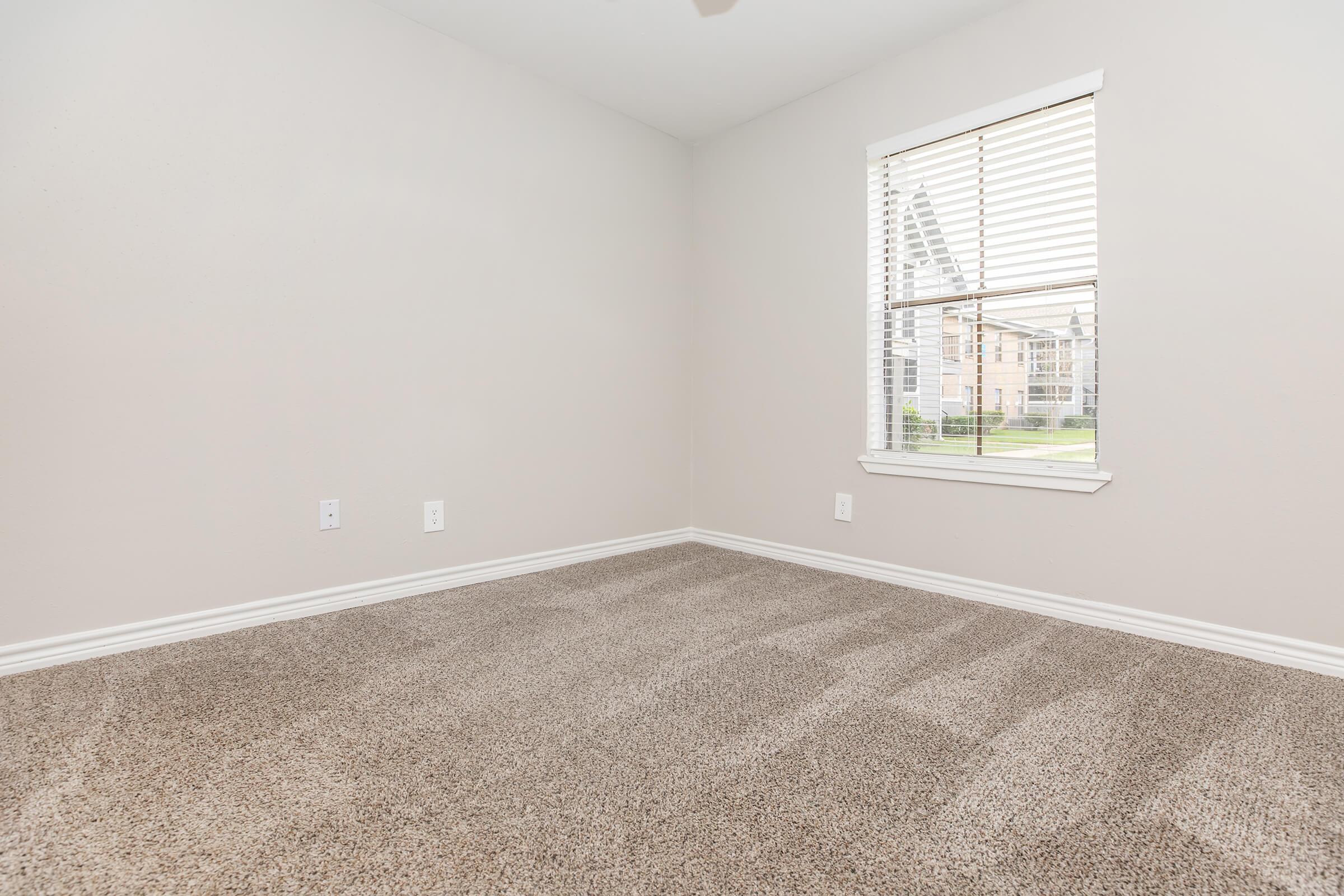 a bedroom with a large window