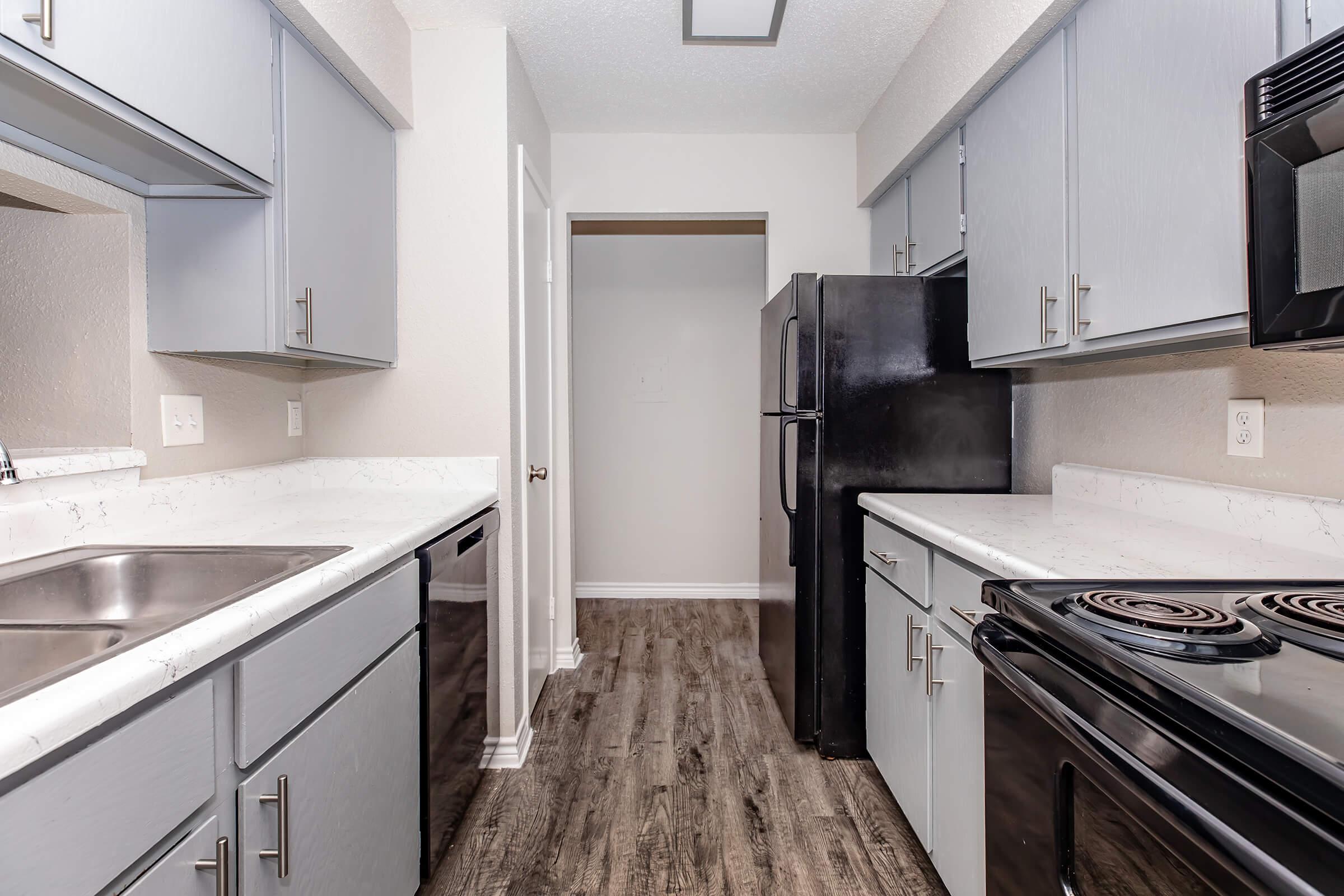 a kitchen with a stove and a sink