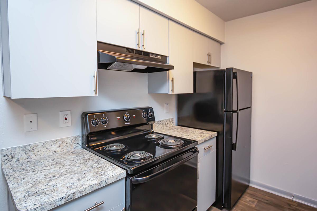a kitchen with a stove top oven
