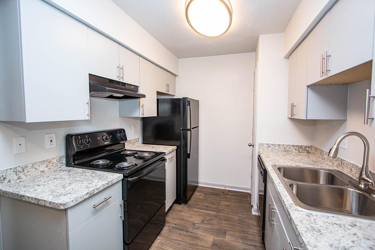 a kitchen with a stove and a sink