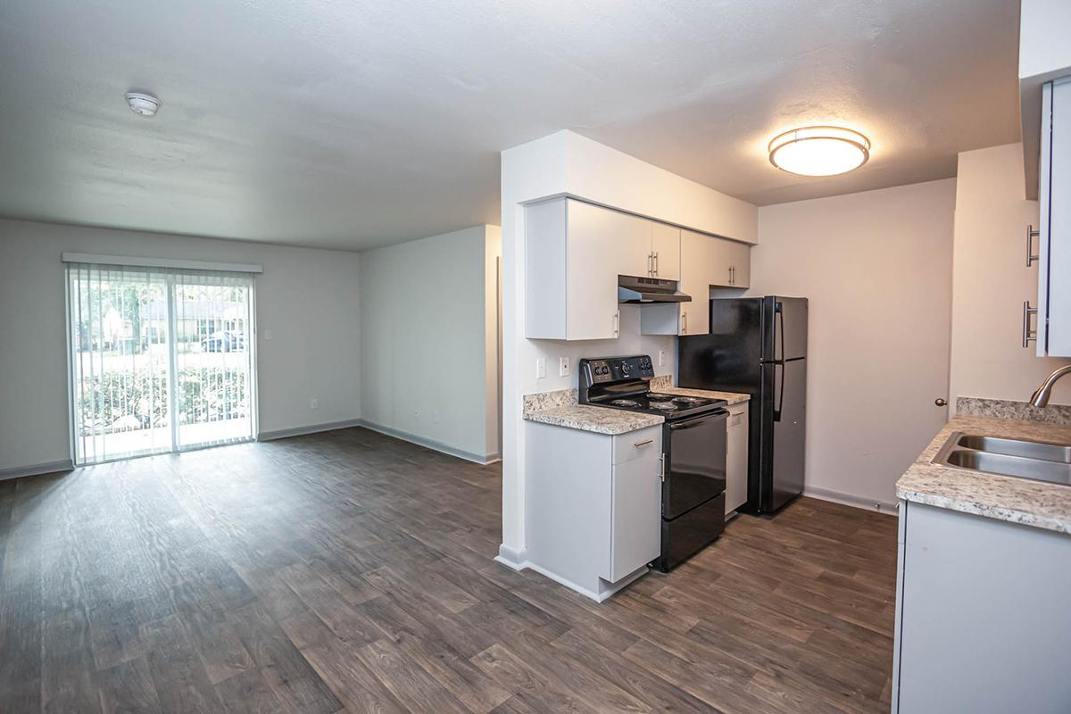 a kitchen with a sink and a refrigerator