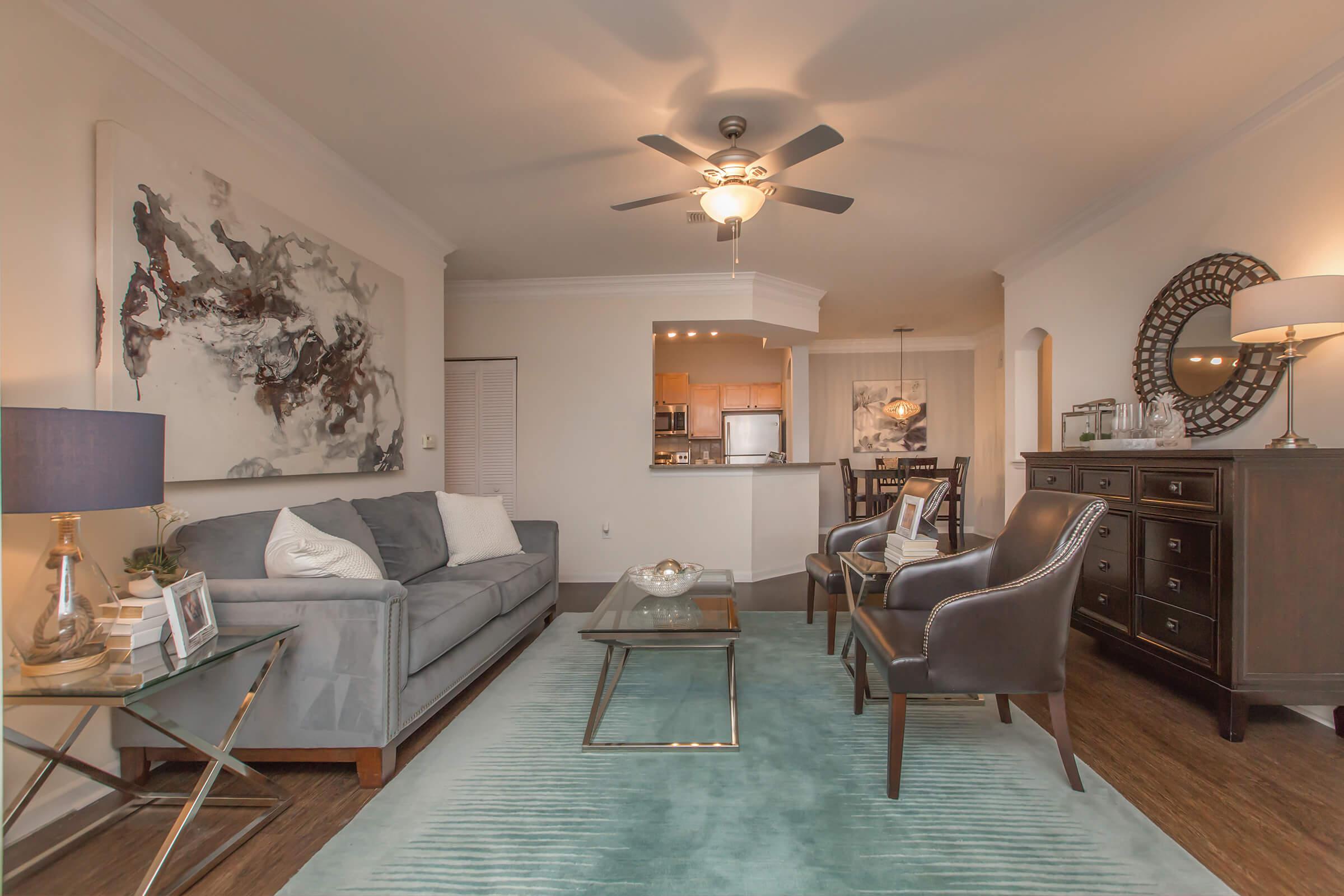 a living room filled with furniture and a fireplace
