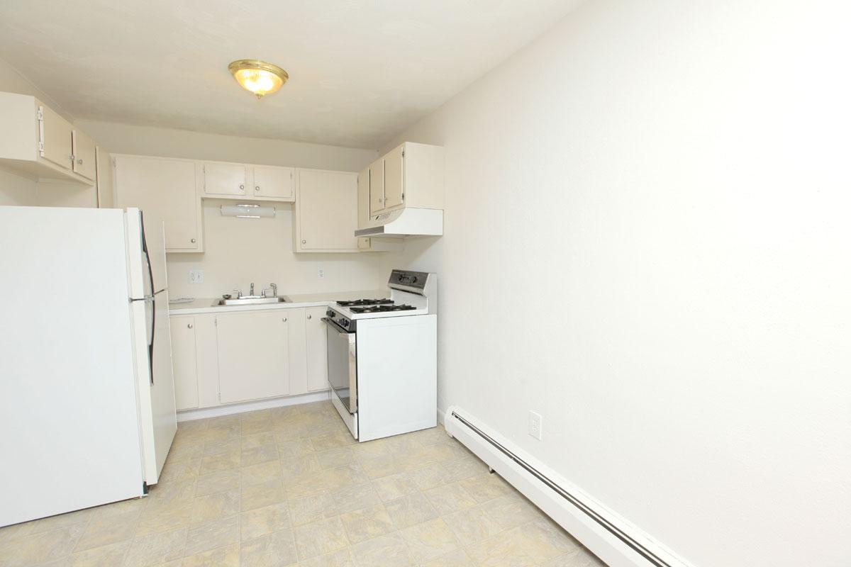 a large white refrigerator in a kitchen