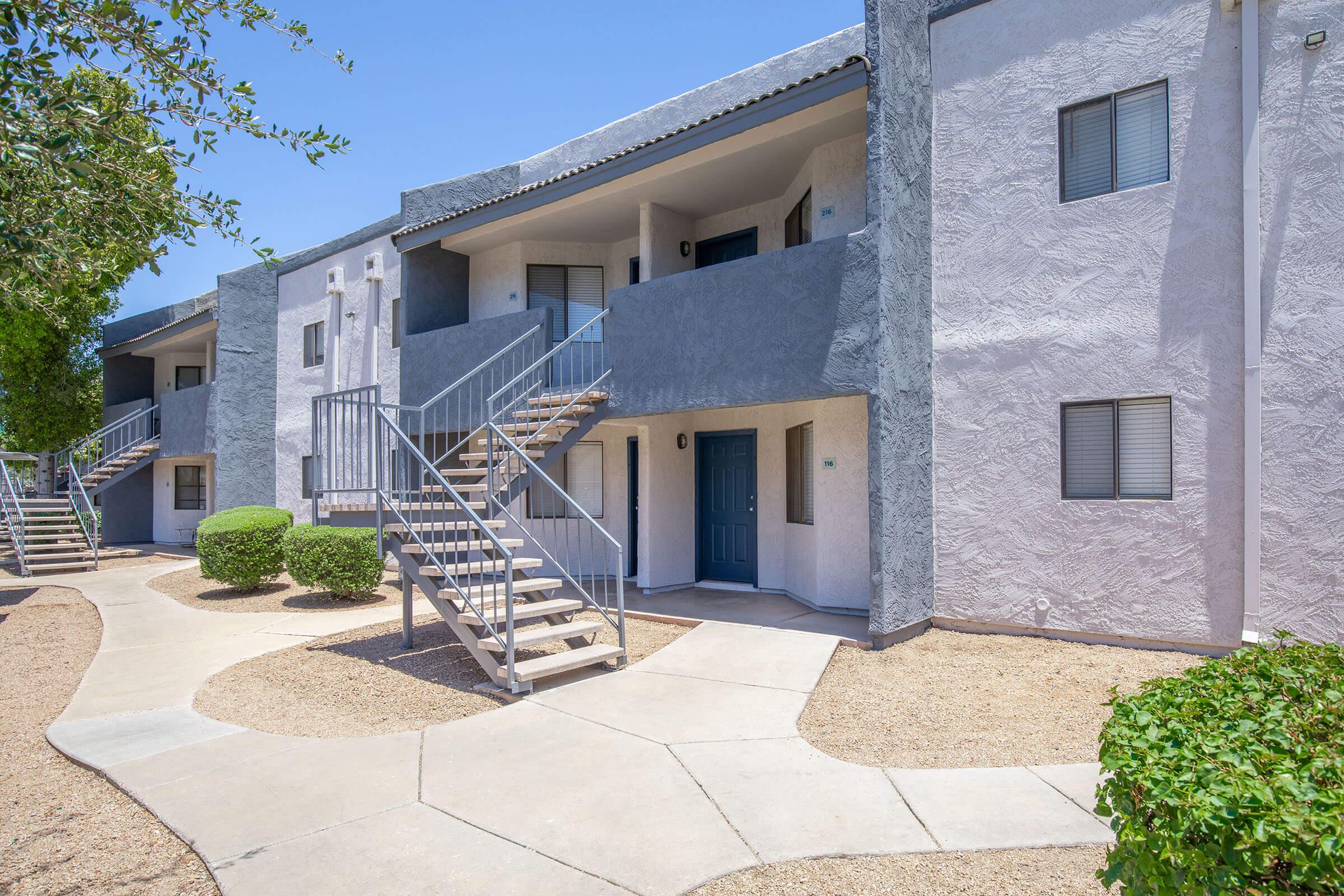 Outdoor view of a two-story Phoenix, AZ apartment building at Rise Desert Cove