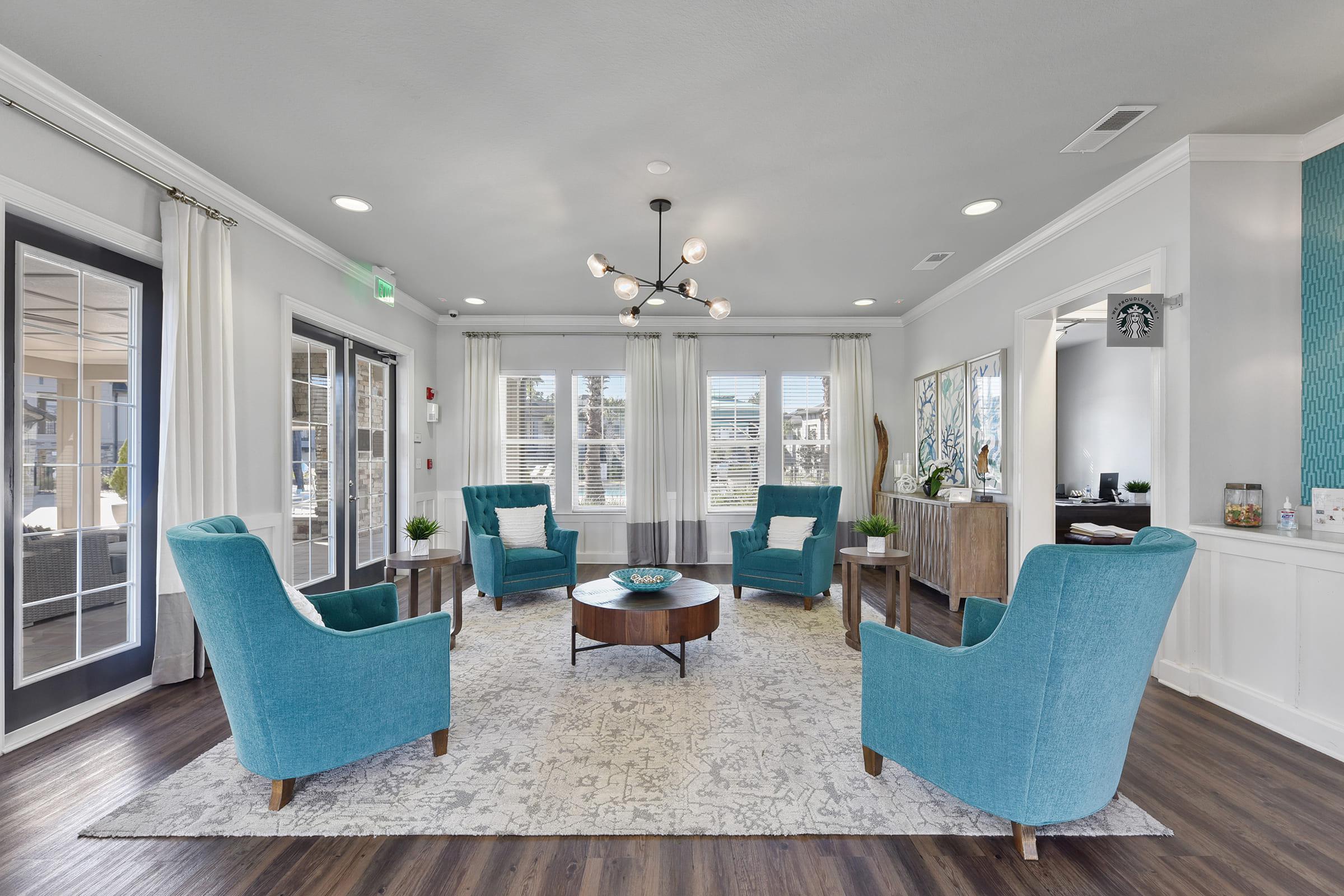 a living room filled with furniture and a large window