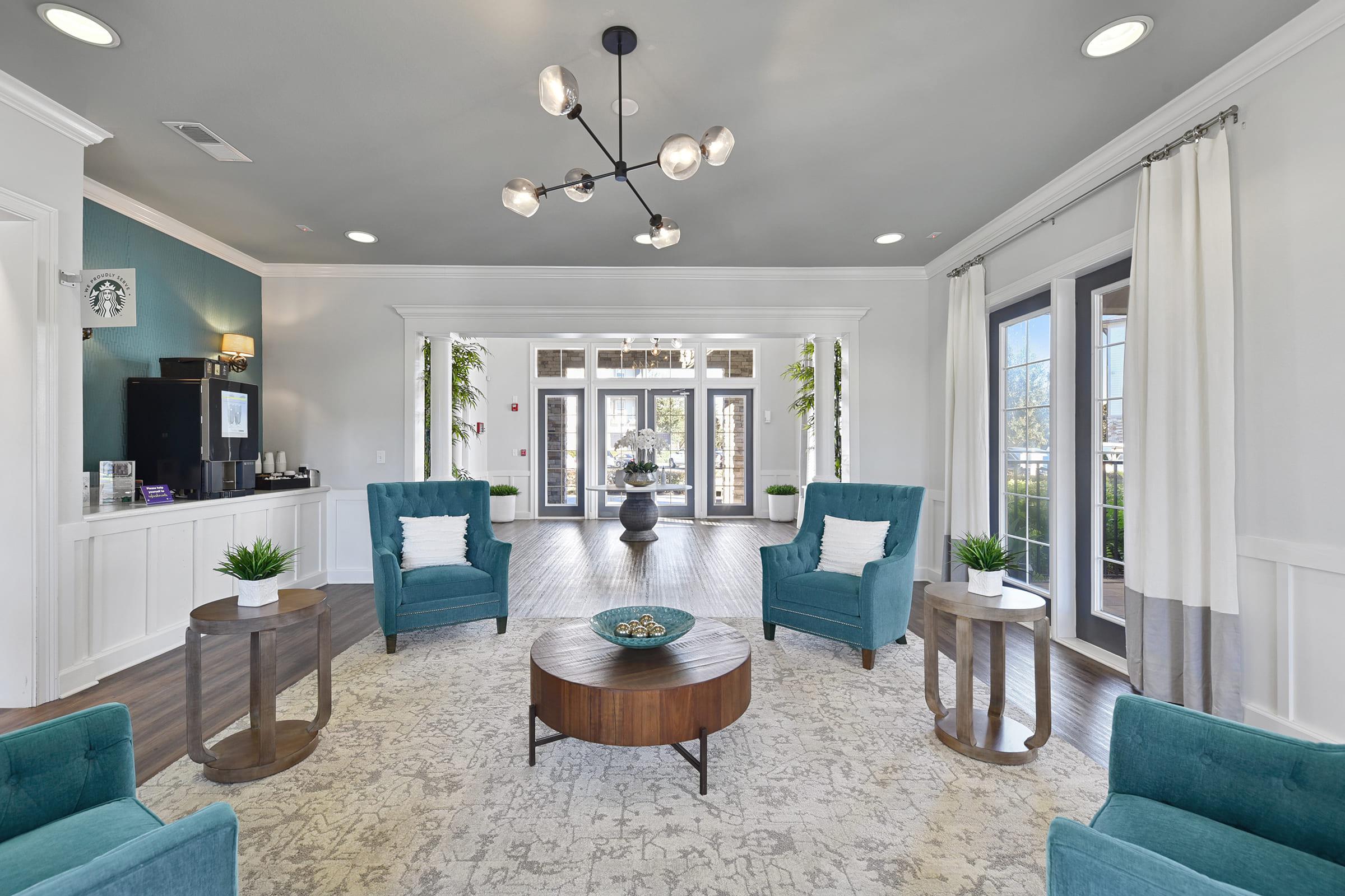 a living room filled with furniture and a large window