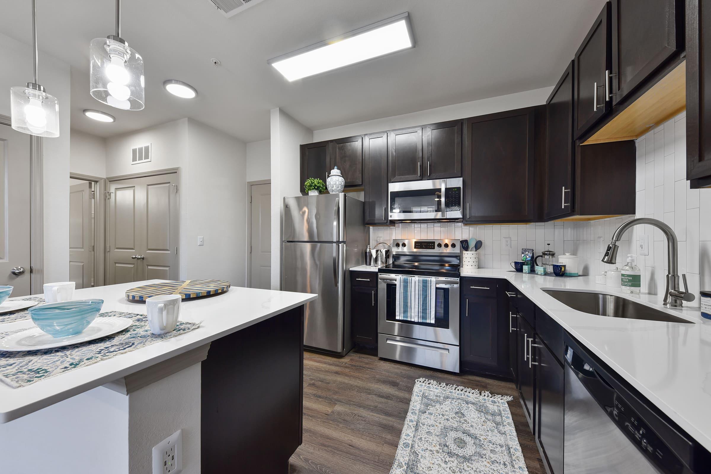 a modern kitchen with stainless steel appliances