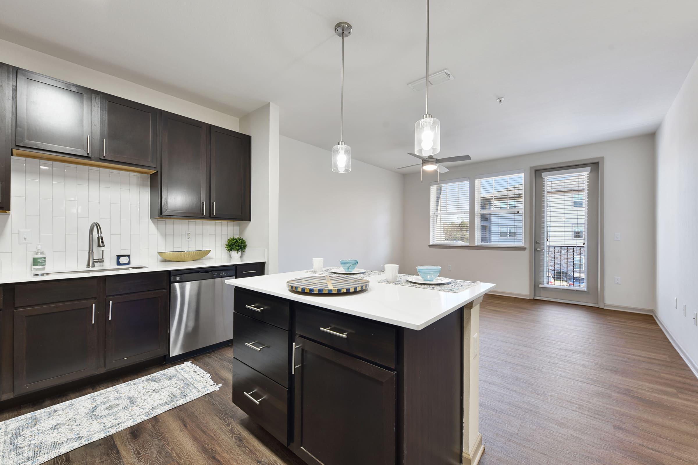 a large kitchen with an island in the middle of a room