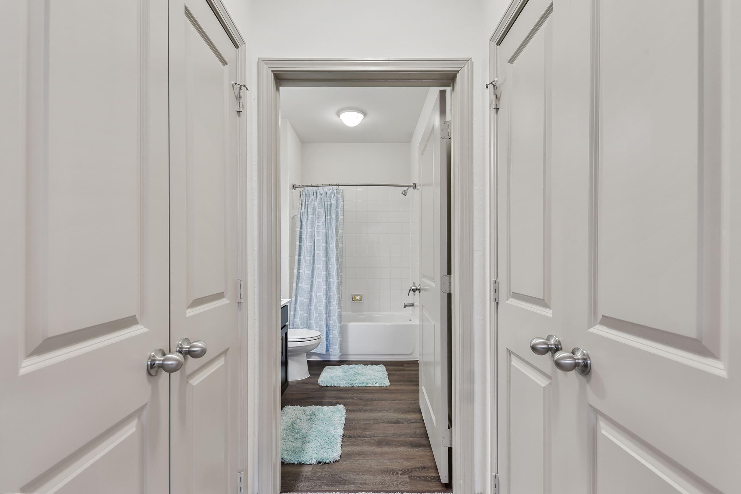 a room with a sink and a mirror