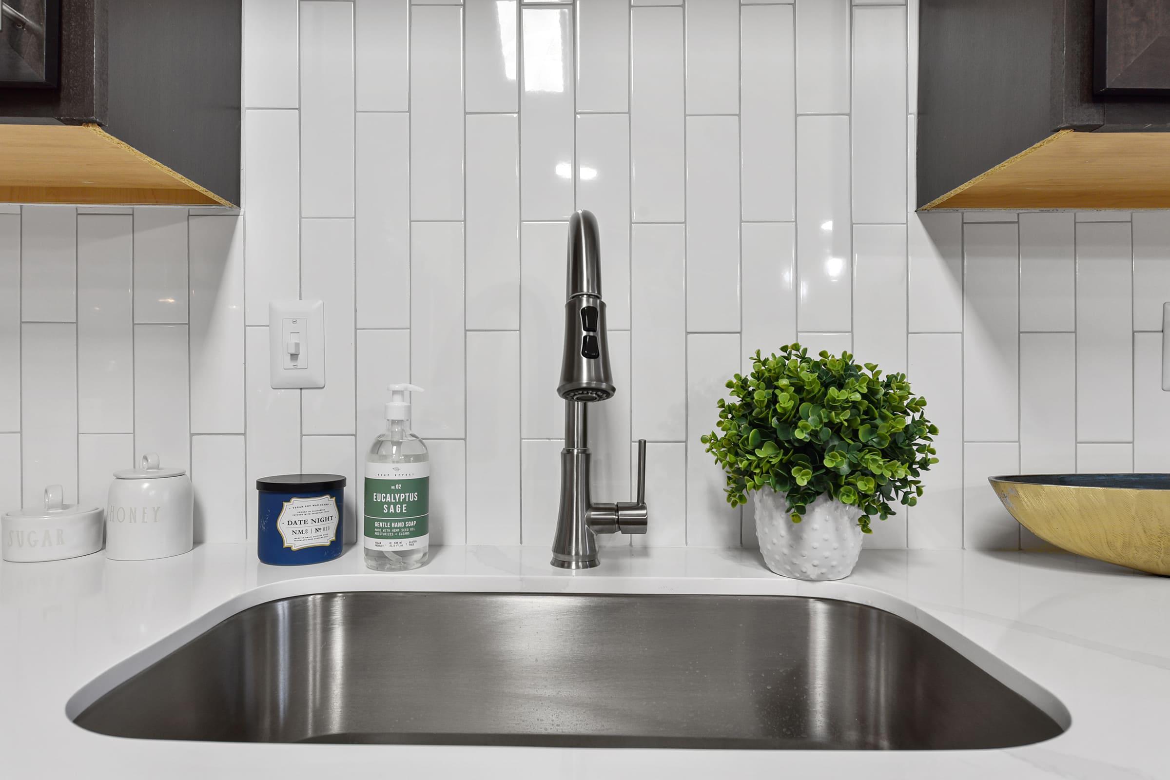 a kitchen with a sink and a microwave