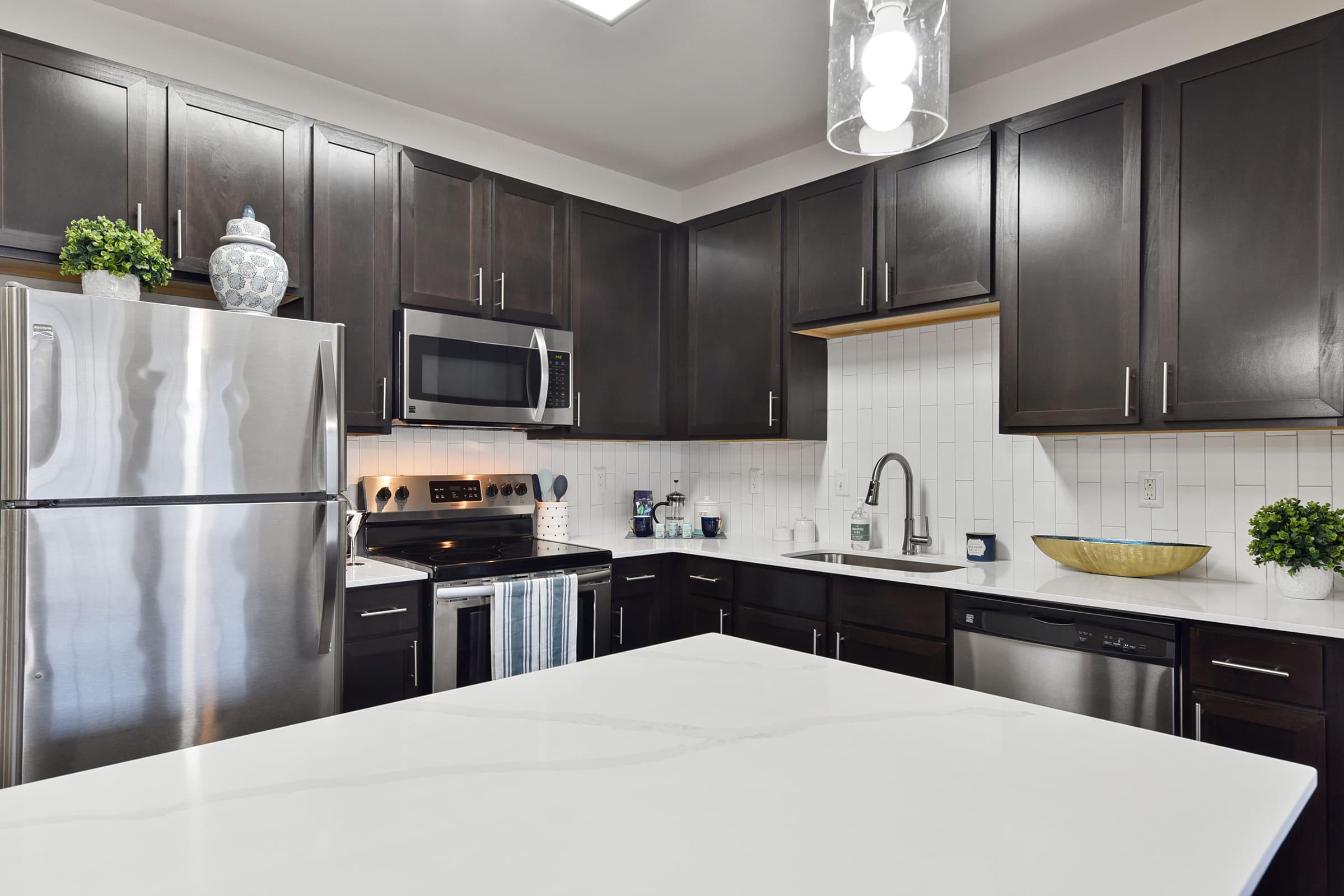 a modern kitchen with stainless steel appliances