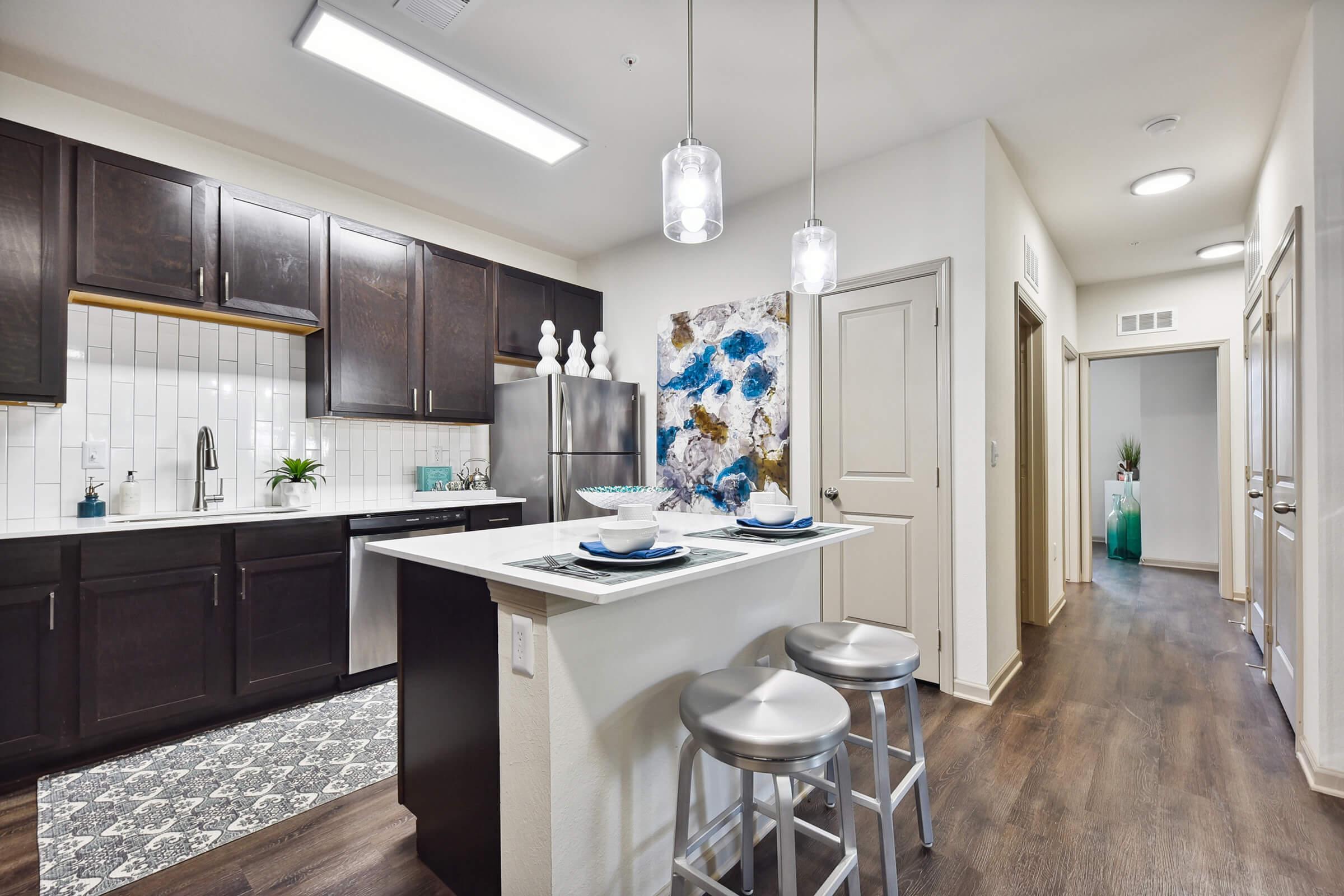 a kitchen with a sink and a window