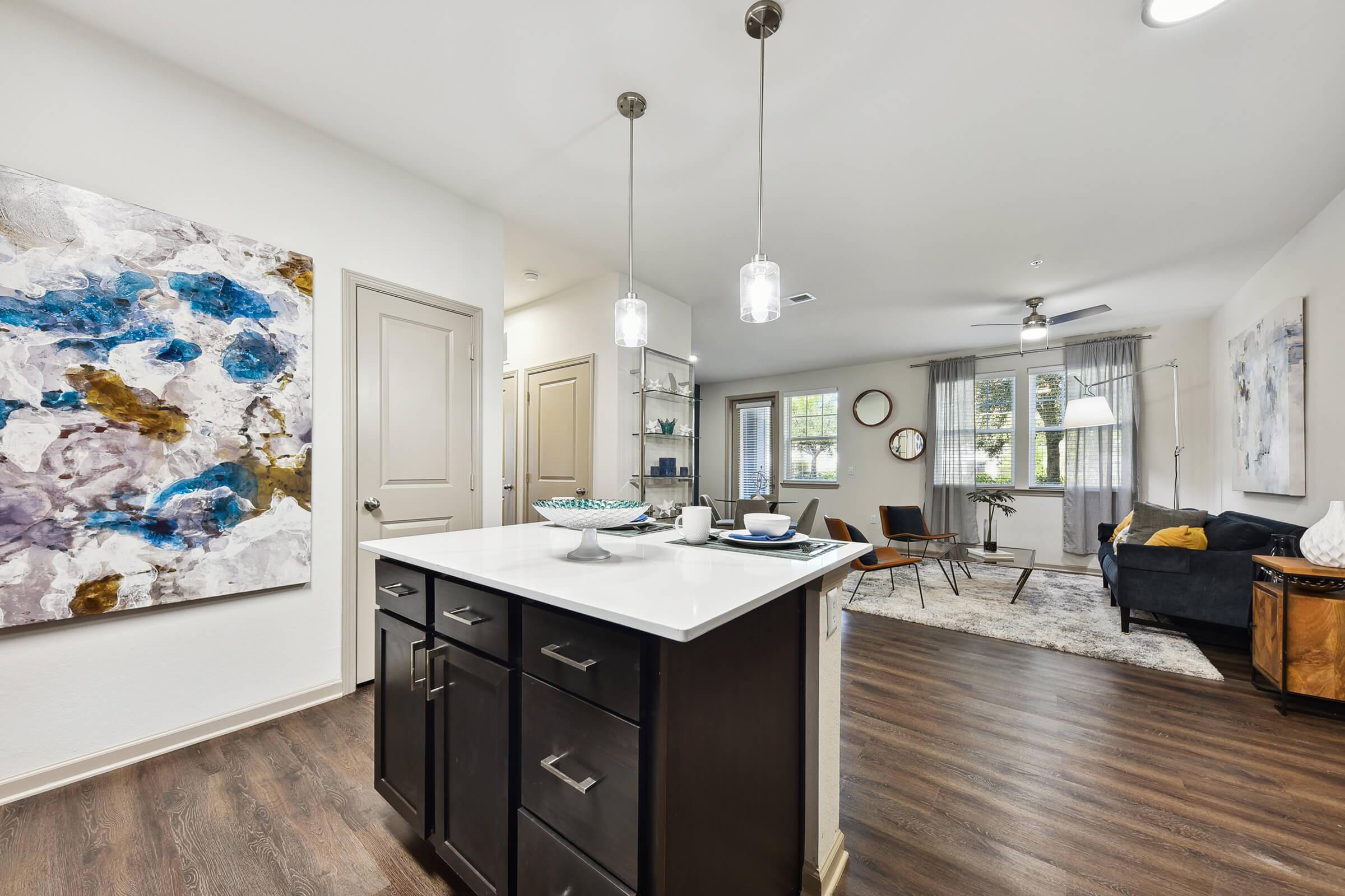 a kitchen with an island in the middle of a room