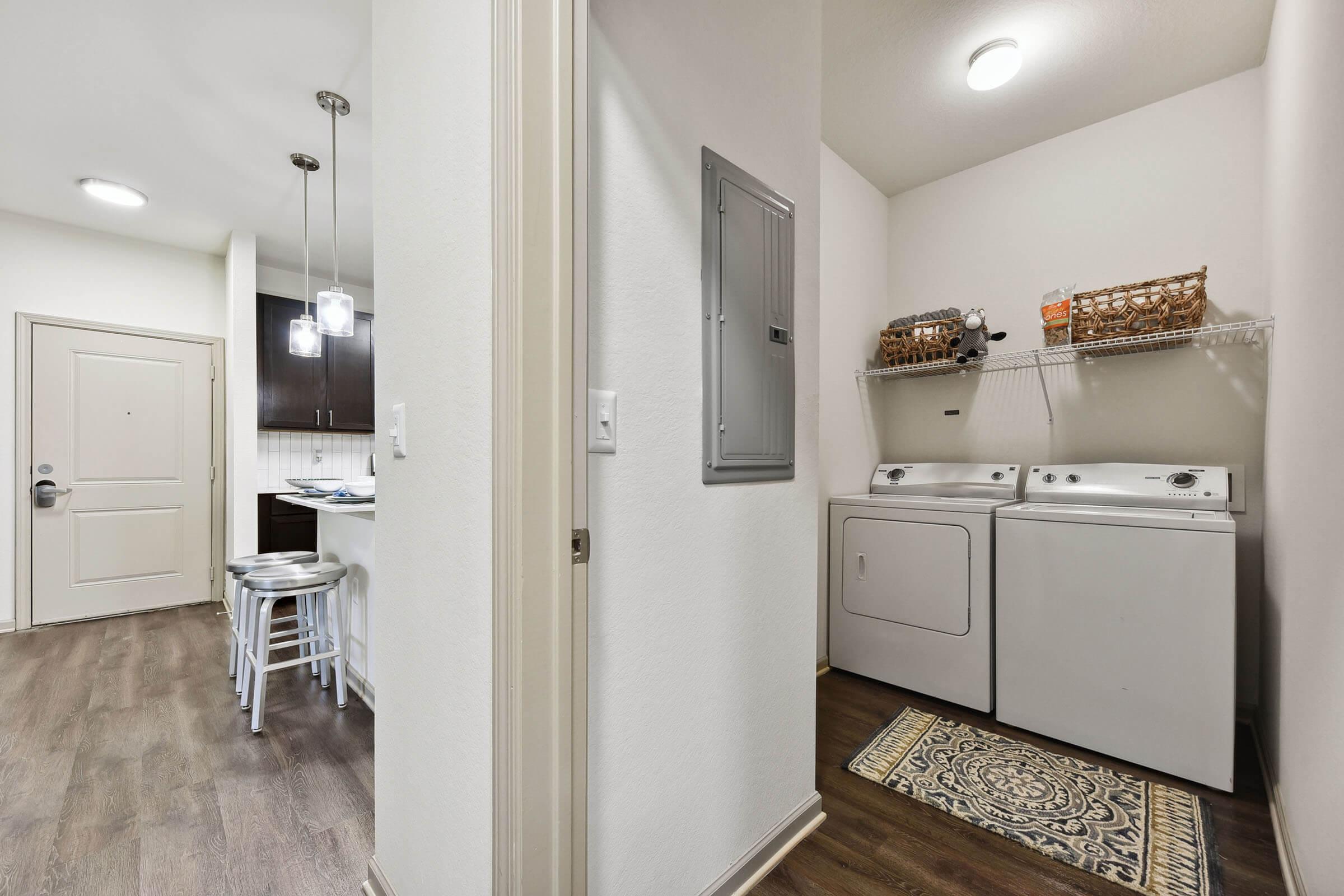 a kitchen with a sink and a mirror