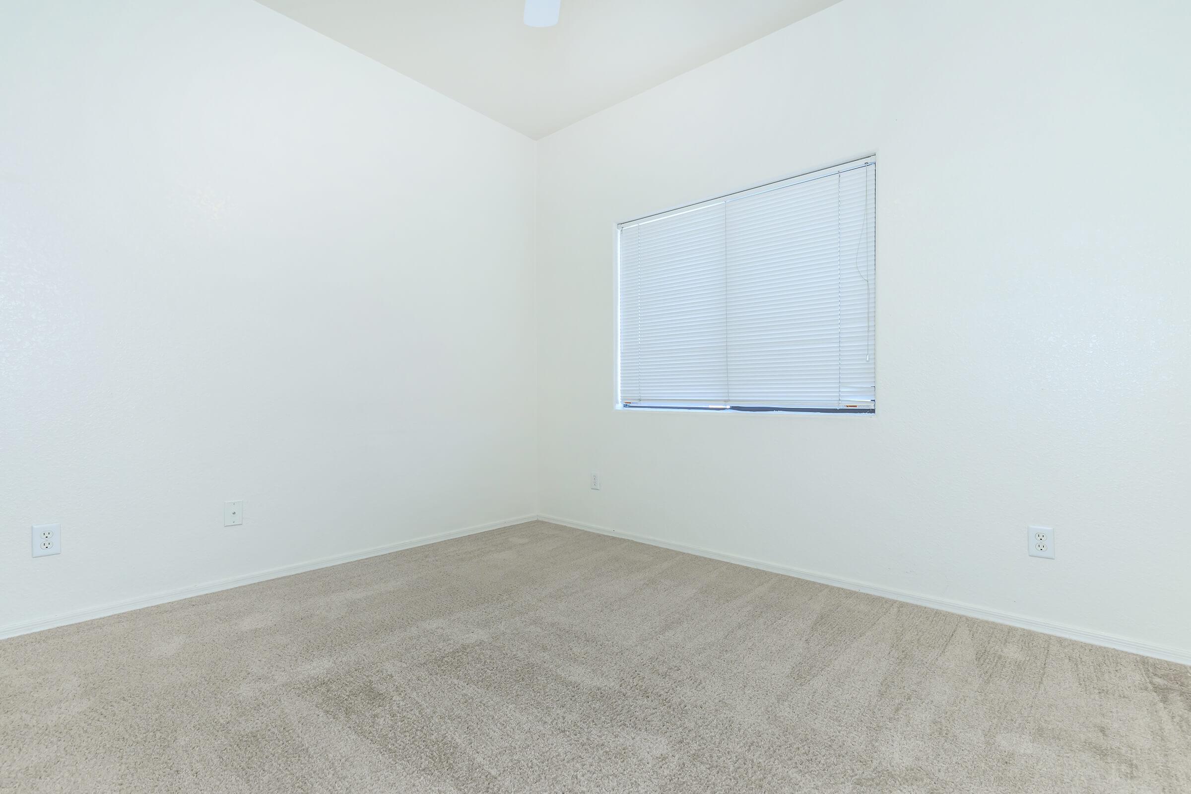 a bedroom with a large window