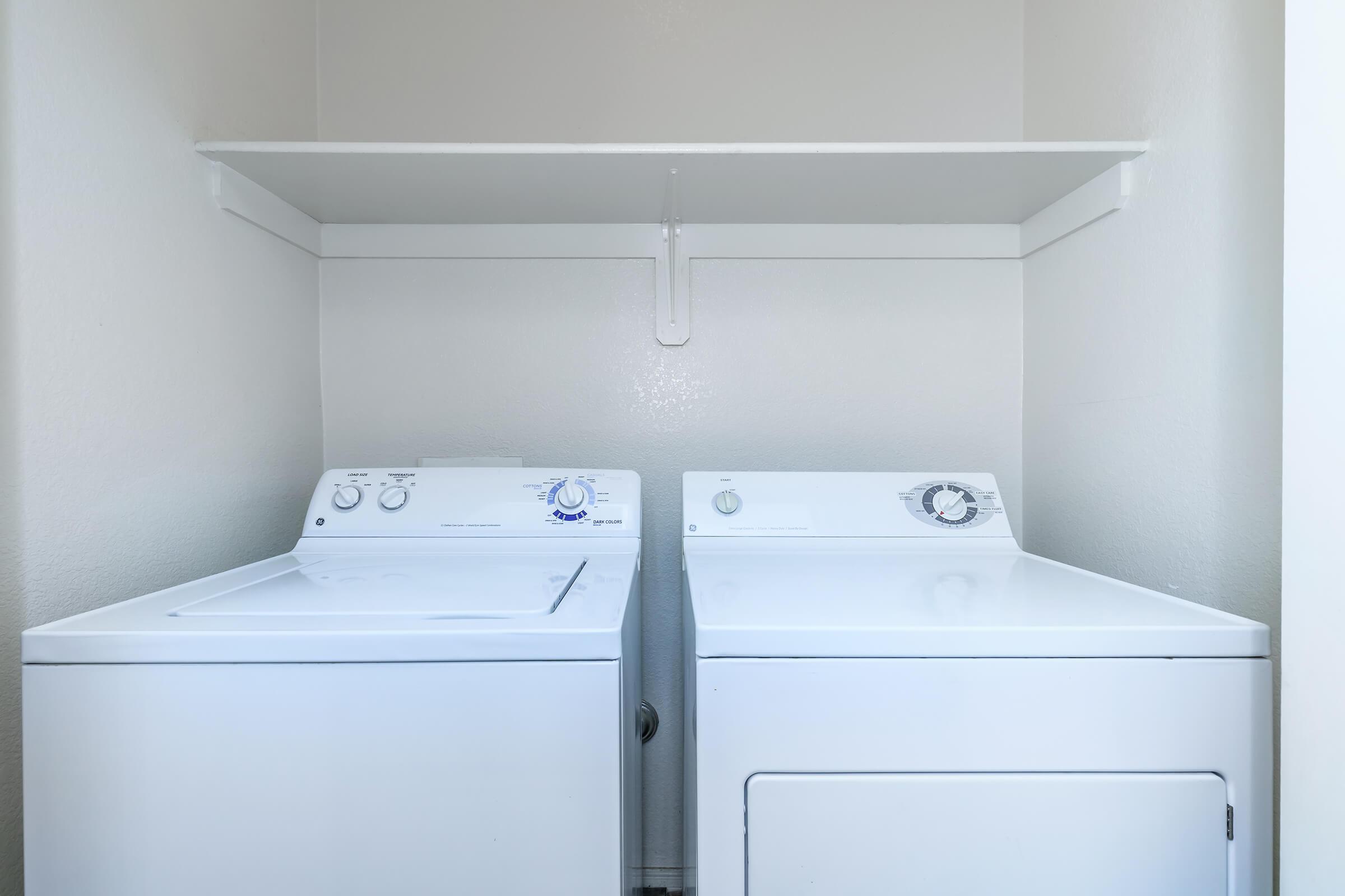 a white refrigerator freezer sitting inside of a kitchen