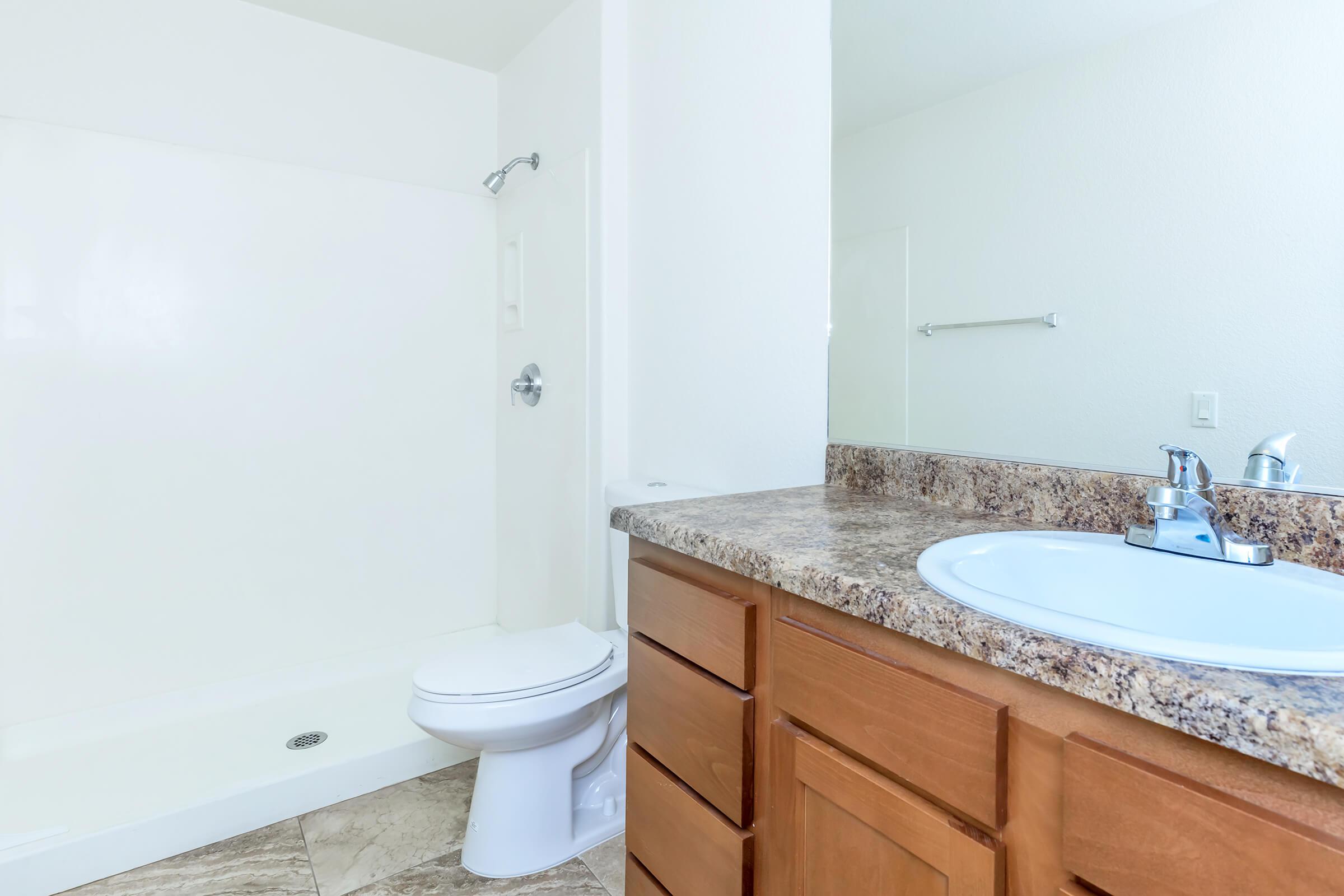 a large white tub next to a sink