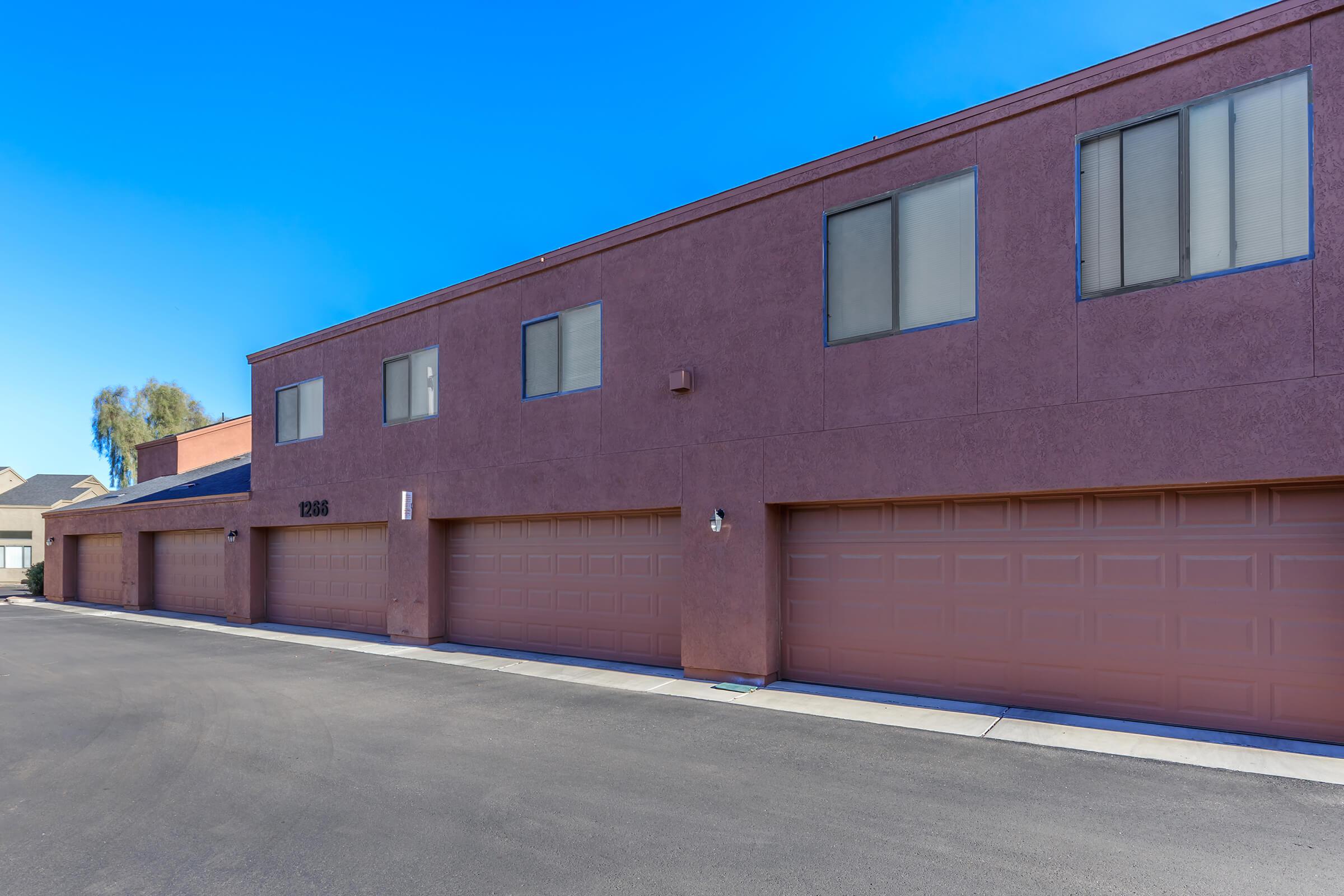 a large brick building with a parking lot