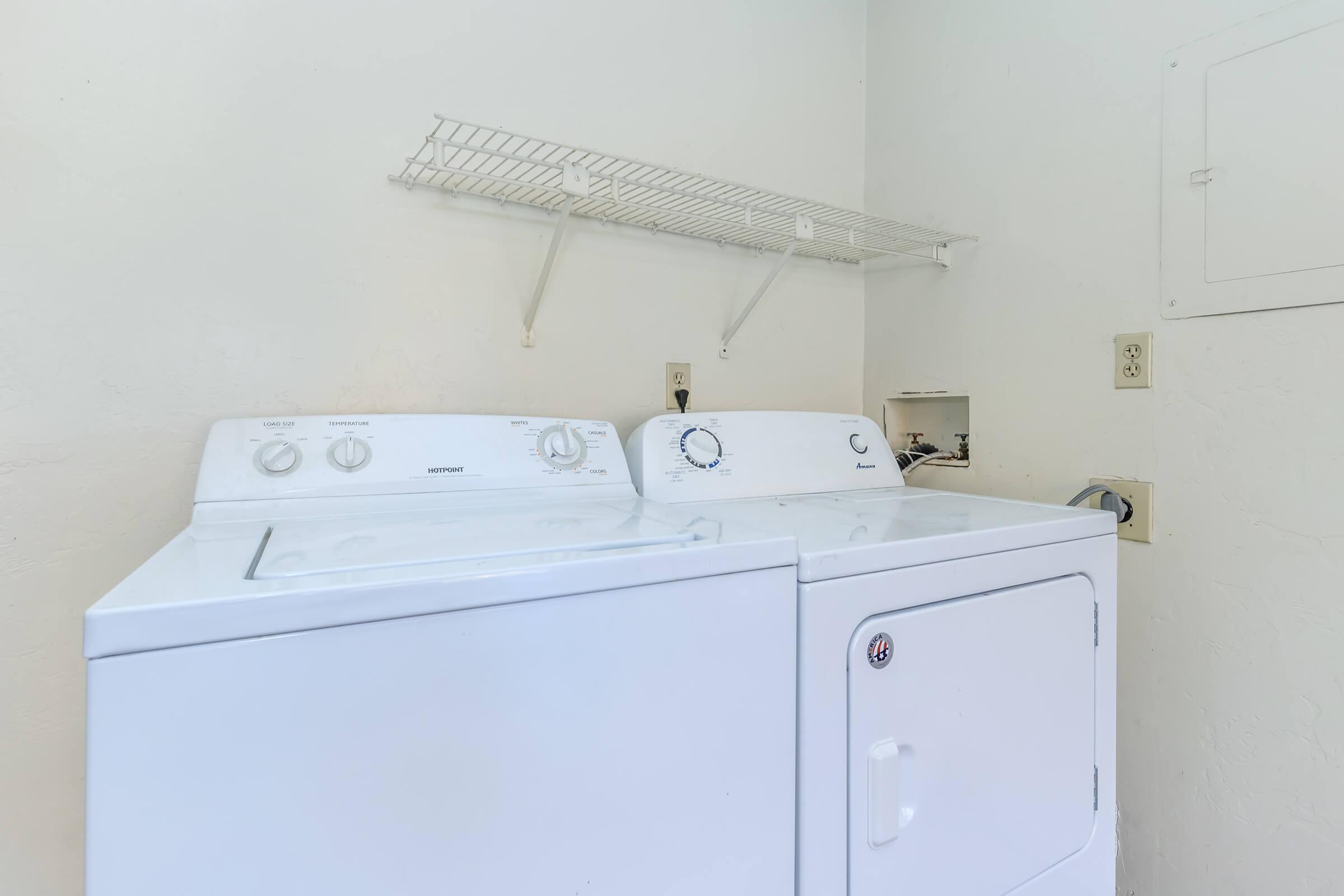 a white refrigerator freezer sitting inside of a kitchen