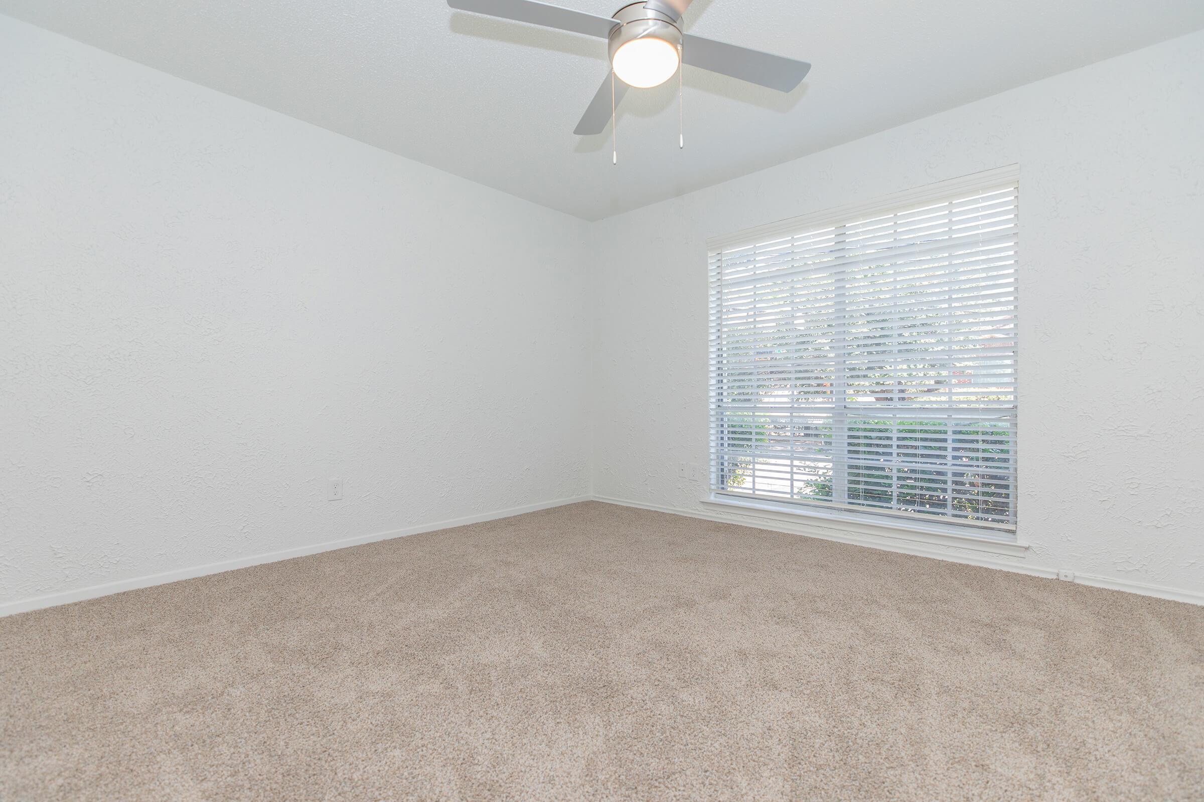 a bedroom with a large window