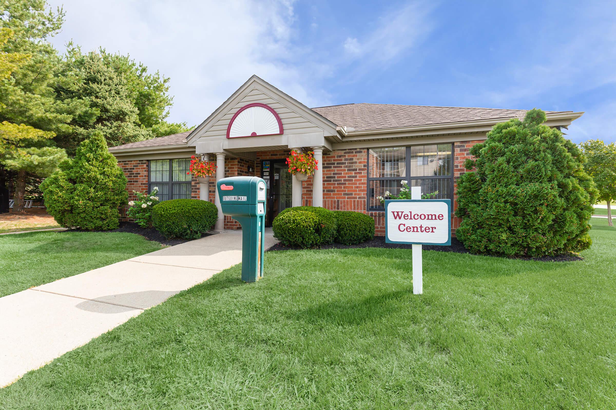 a green lawn in front of a house