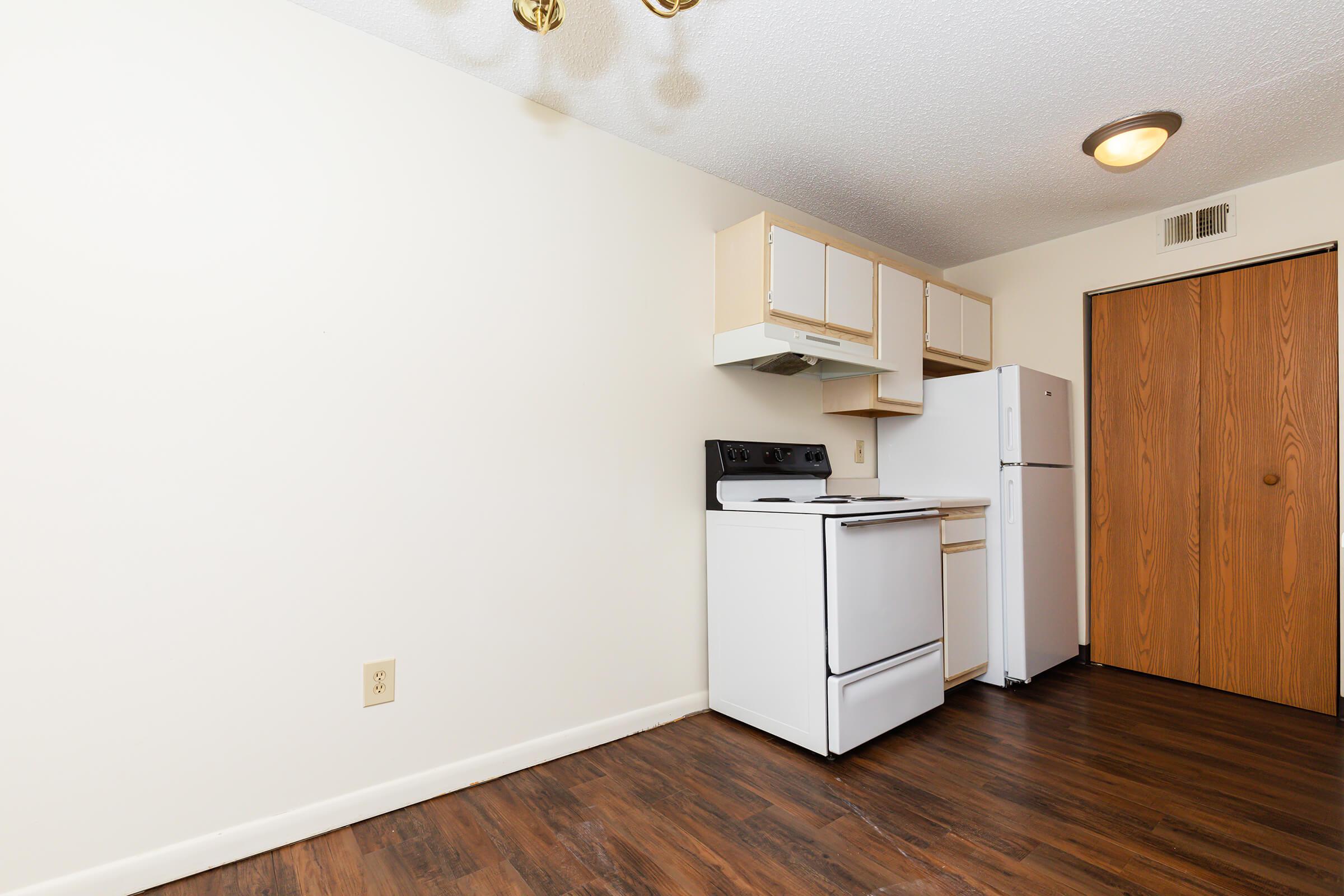 a kitchen with a wood floor