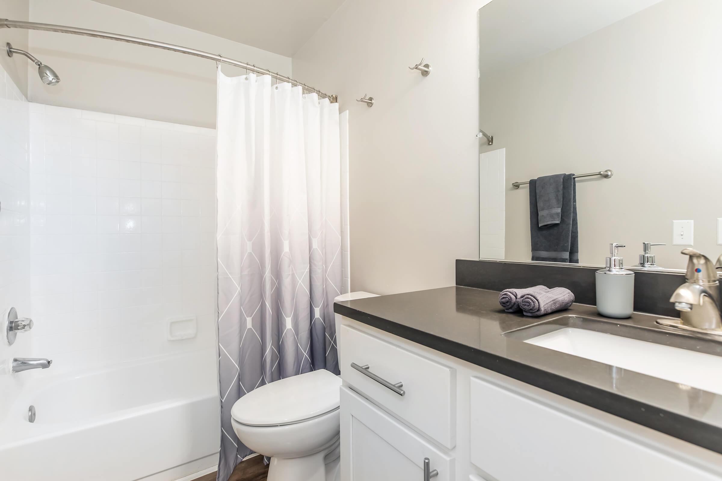 a kitchen with a sink and a mirror