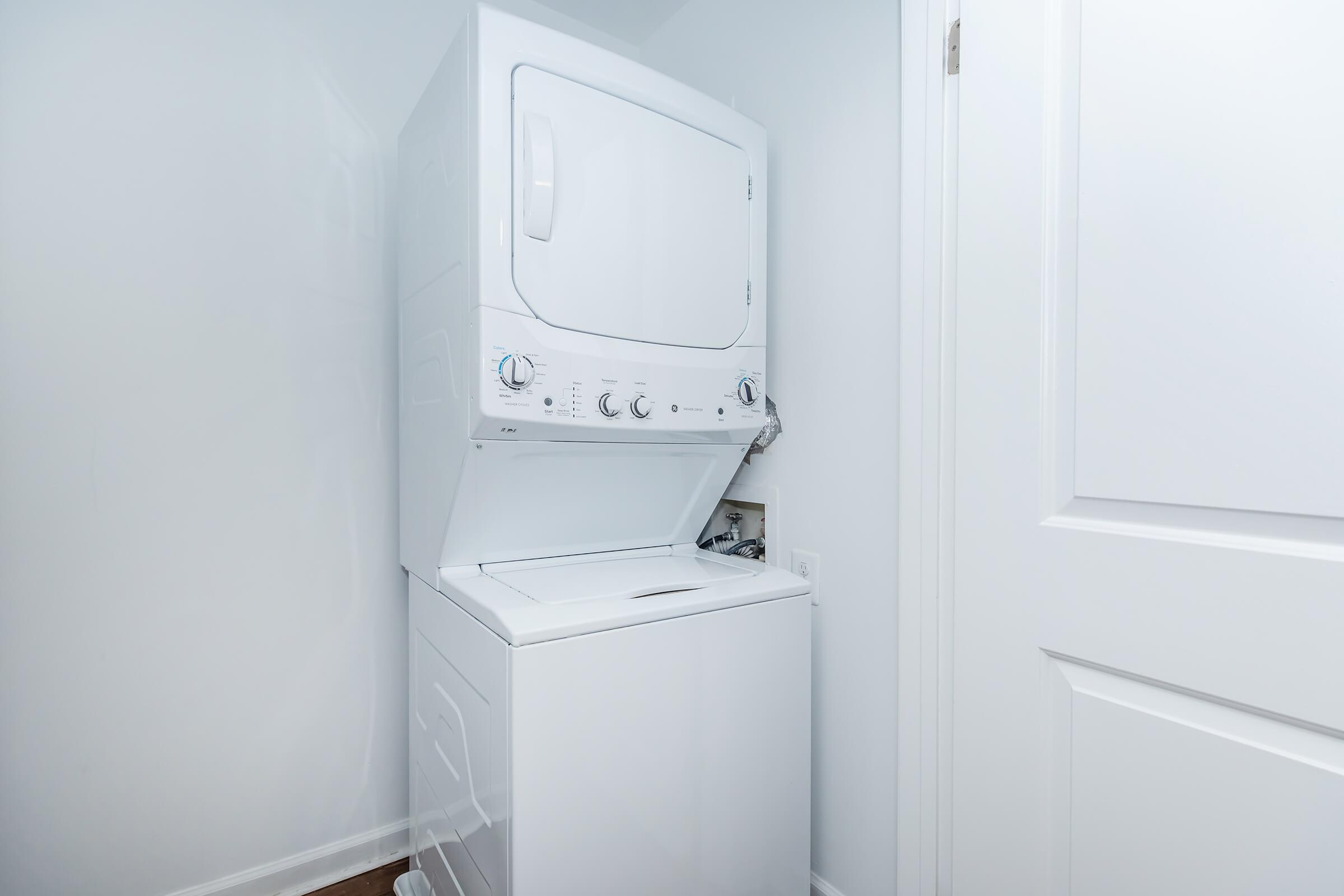 a microwave oven sitting on top of a refrigerator