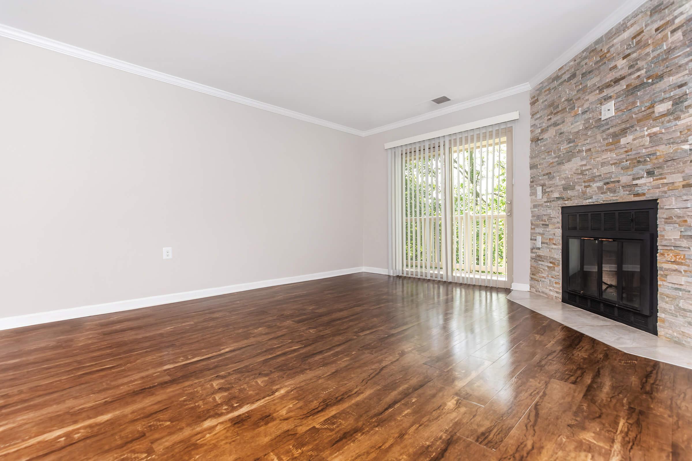 a view of a living room with a wood floor