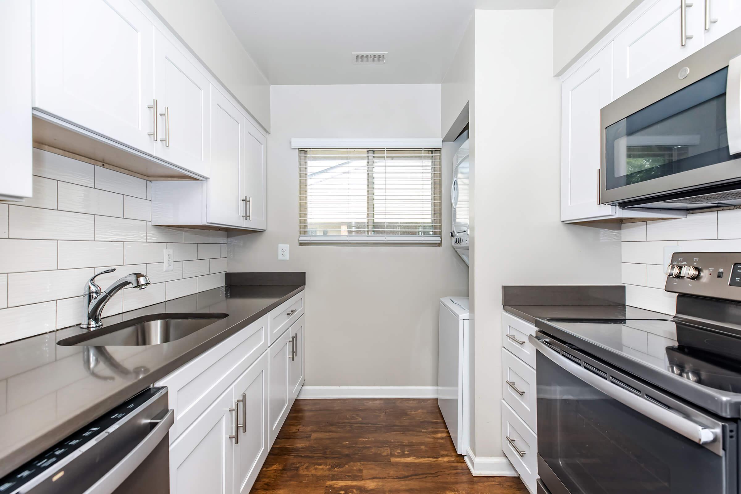 a kitchen with a stove top oven