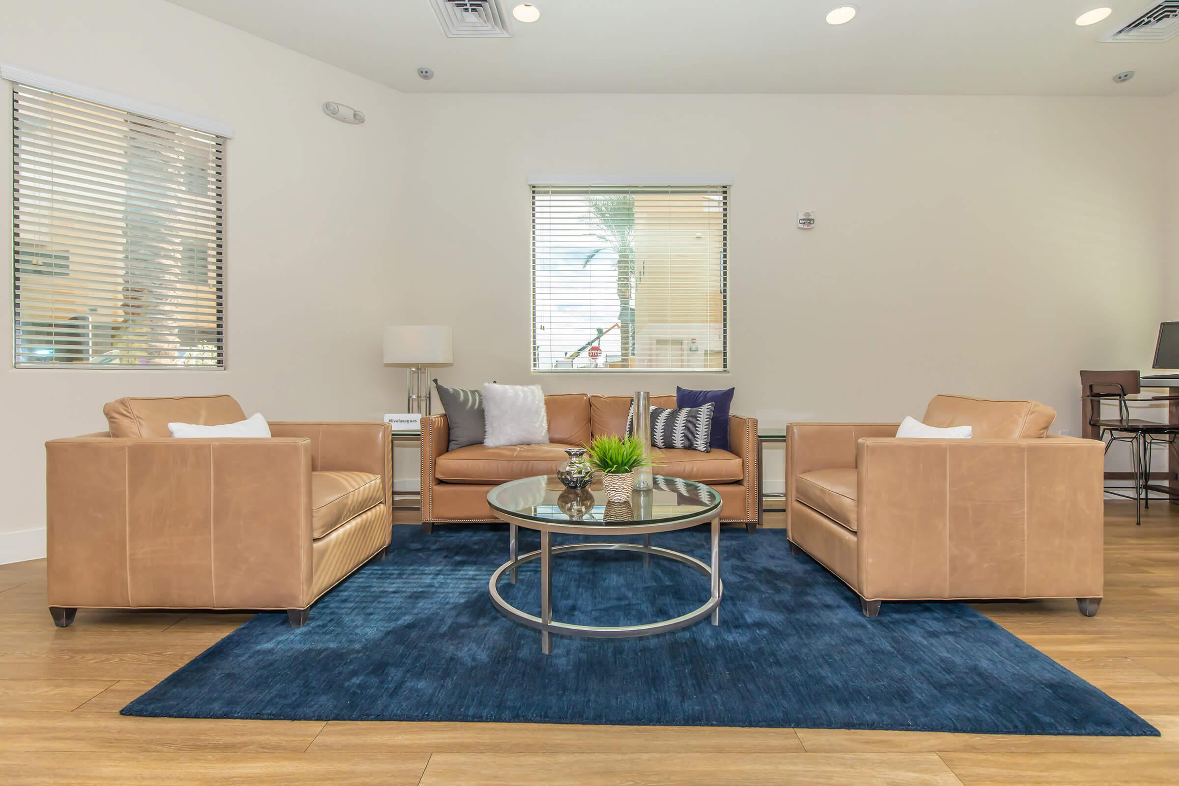 a living room filled with furniture and a tv