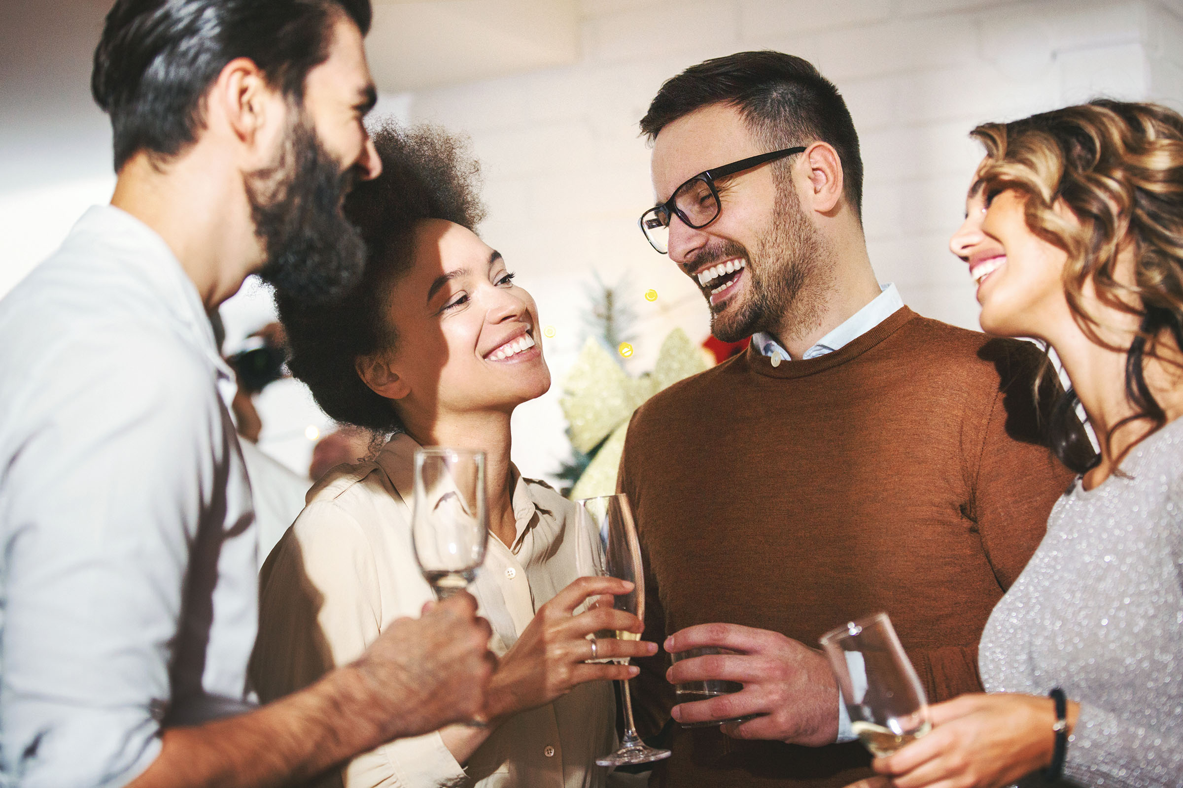 a group of people holding wine glasses