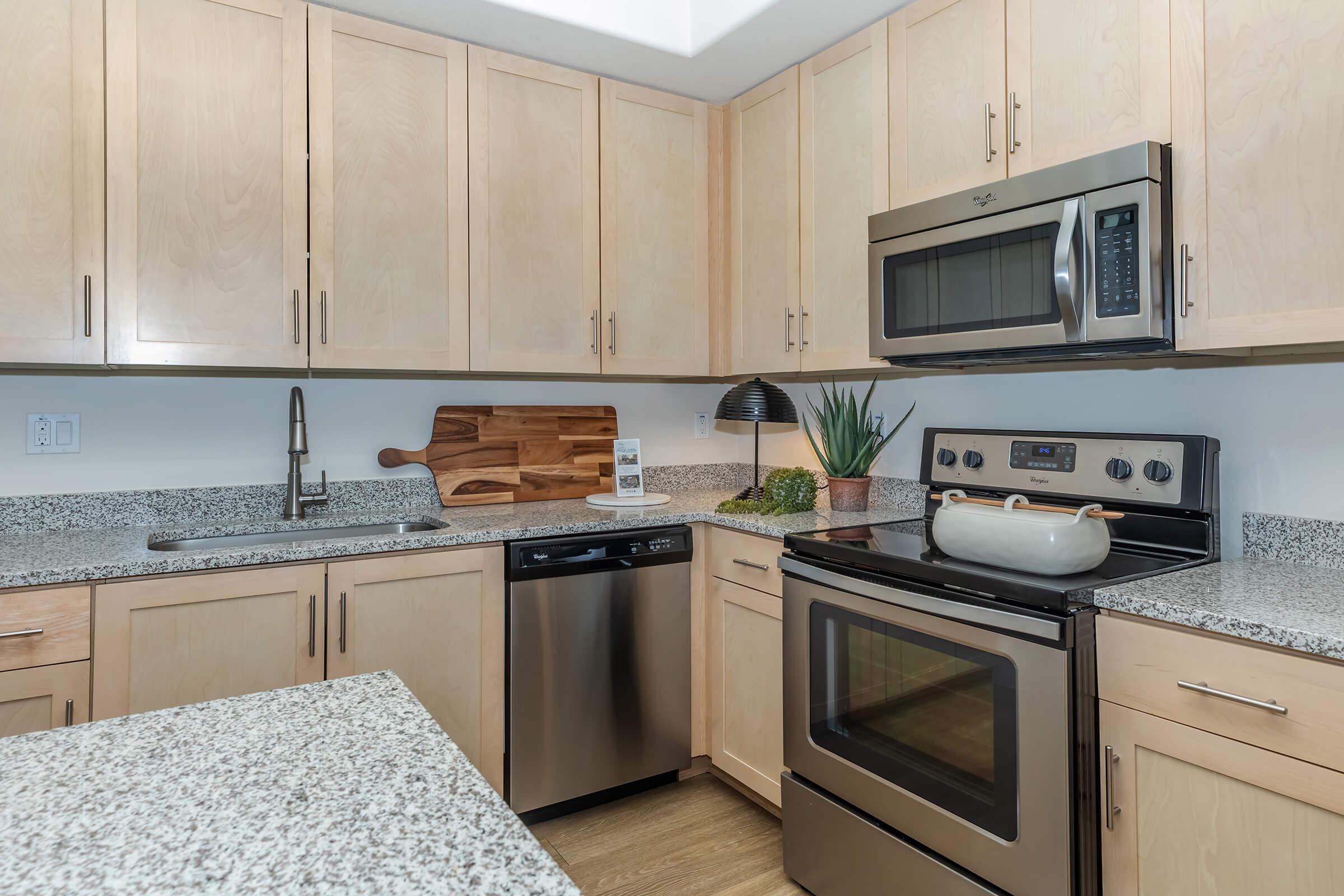 a kitchen with a stove and a microwave