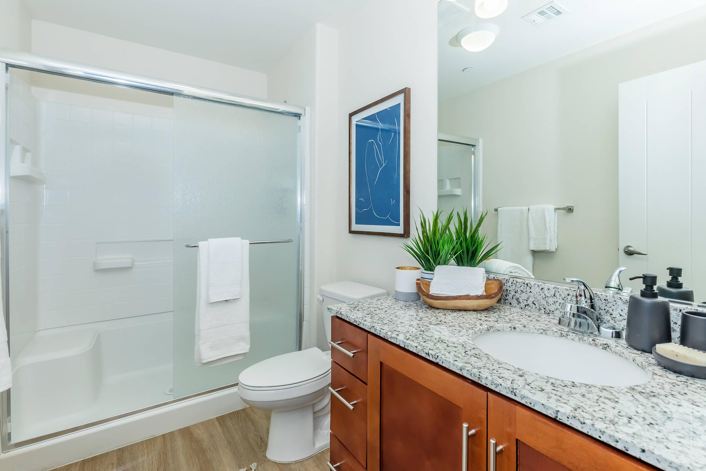 a kitchen with a sink and a mirror