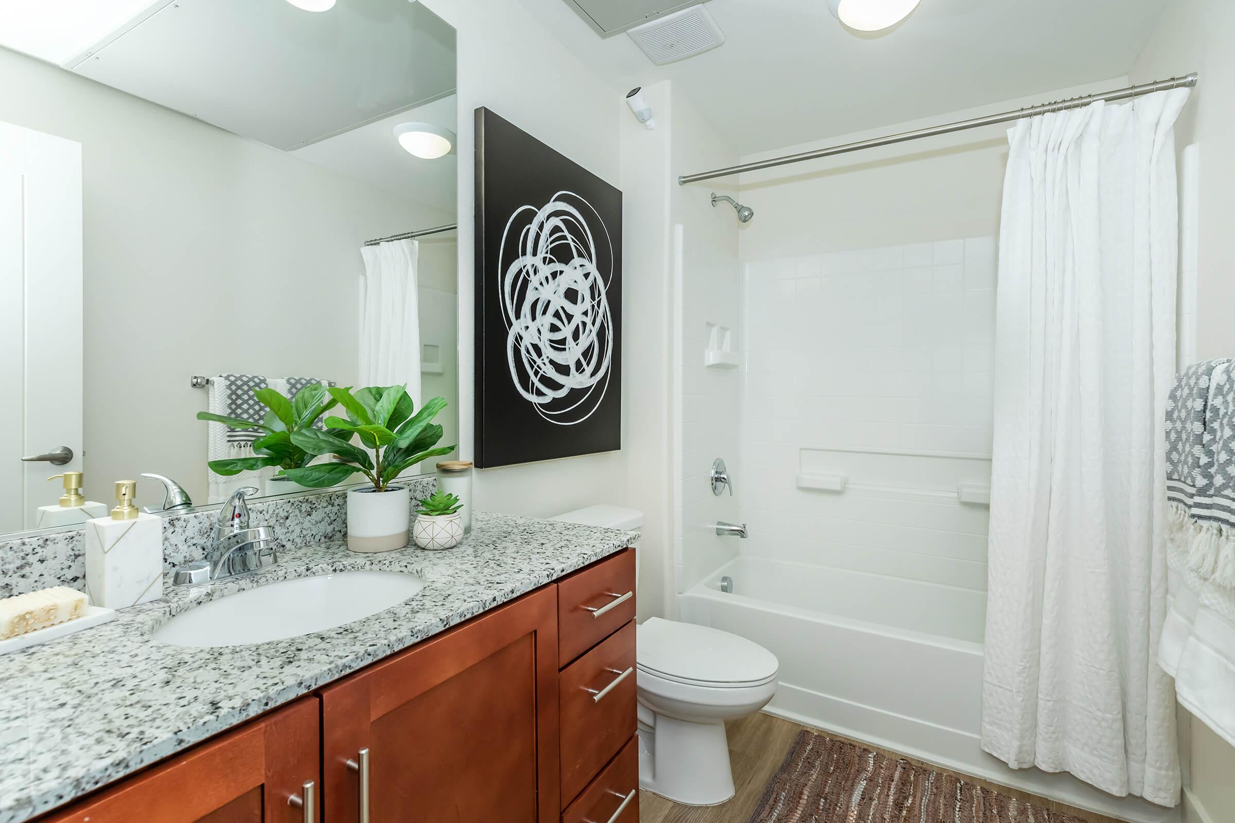 a kitchen with a sink and a mirror