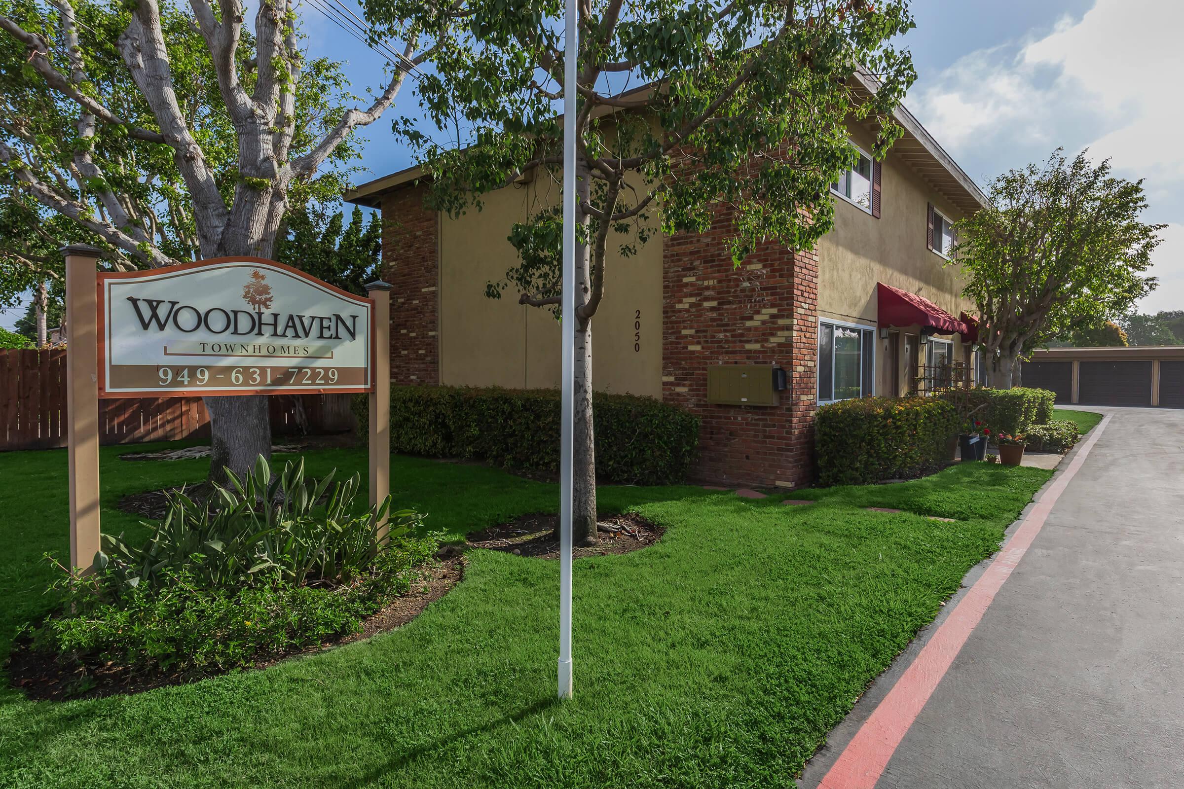 Woodhaven Townhomes community building and sign