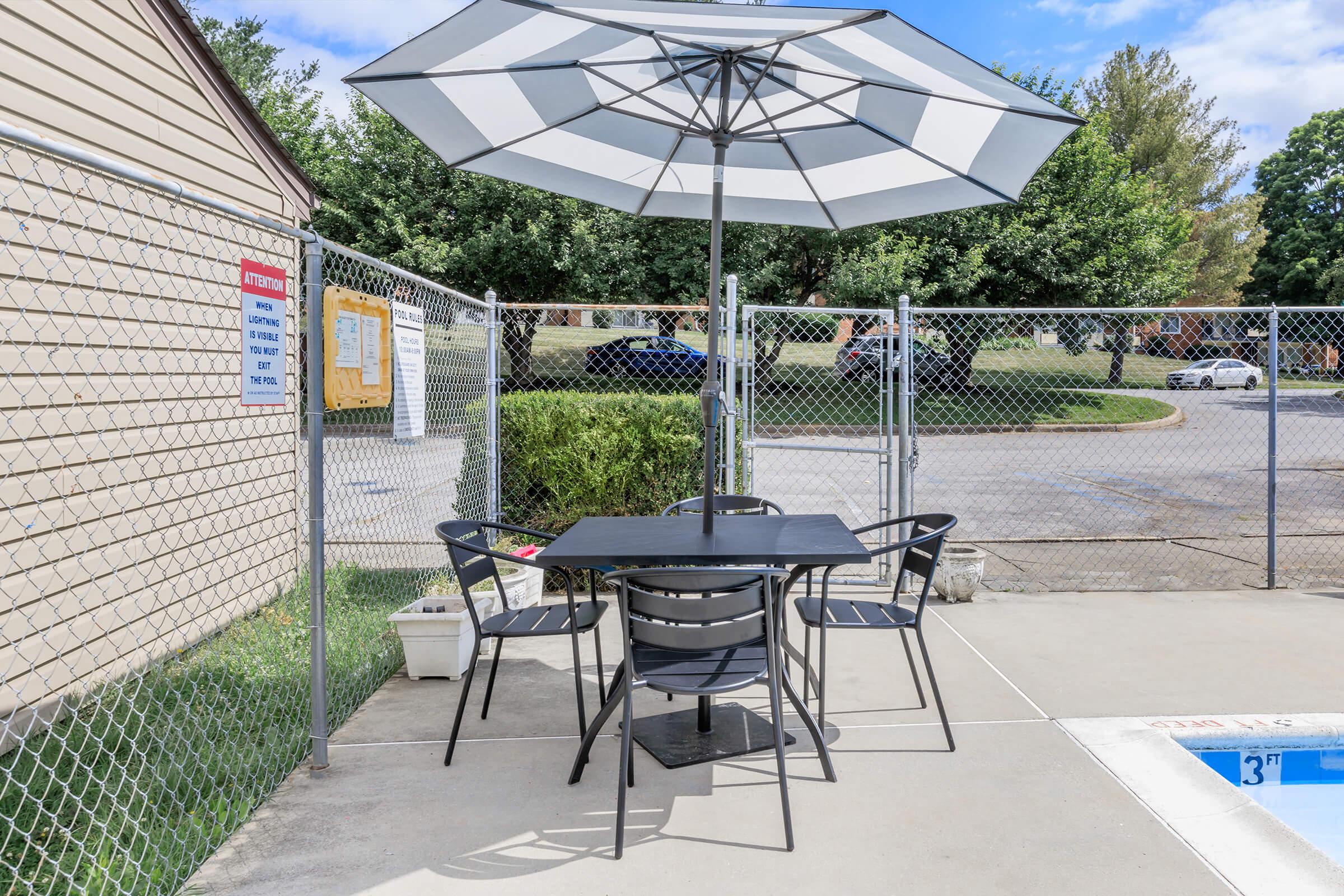 a lawn chair under an umbrella