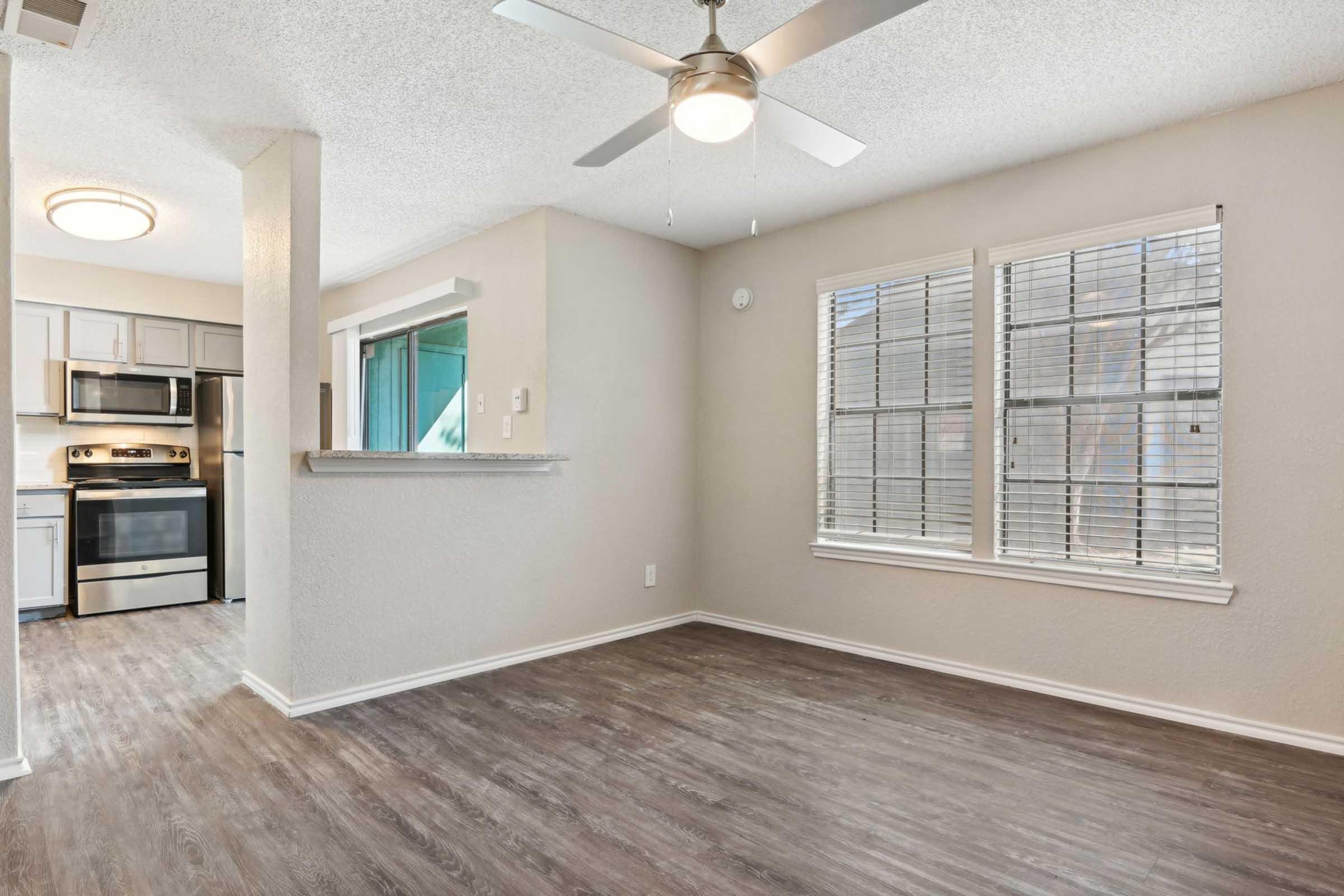 a room filled with furniture and a large window