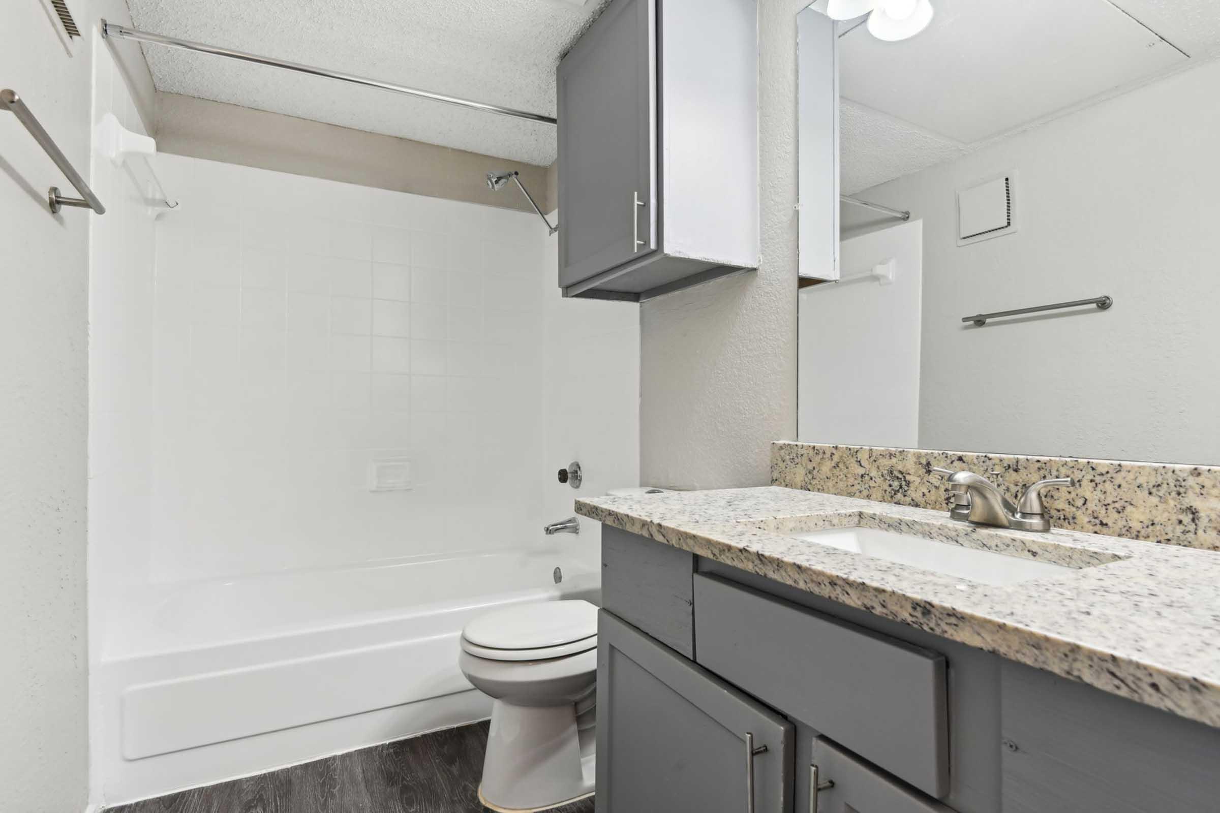 a kitchen with a sink and a mirror