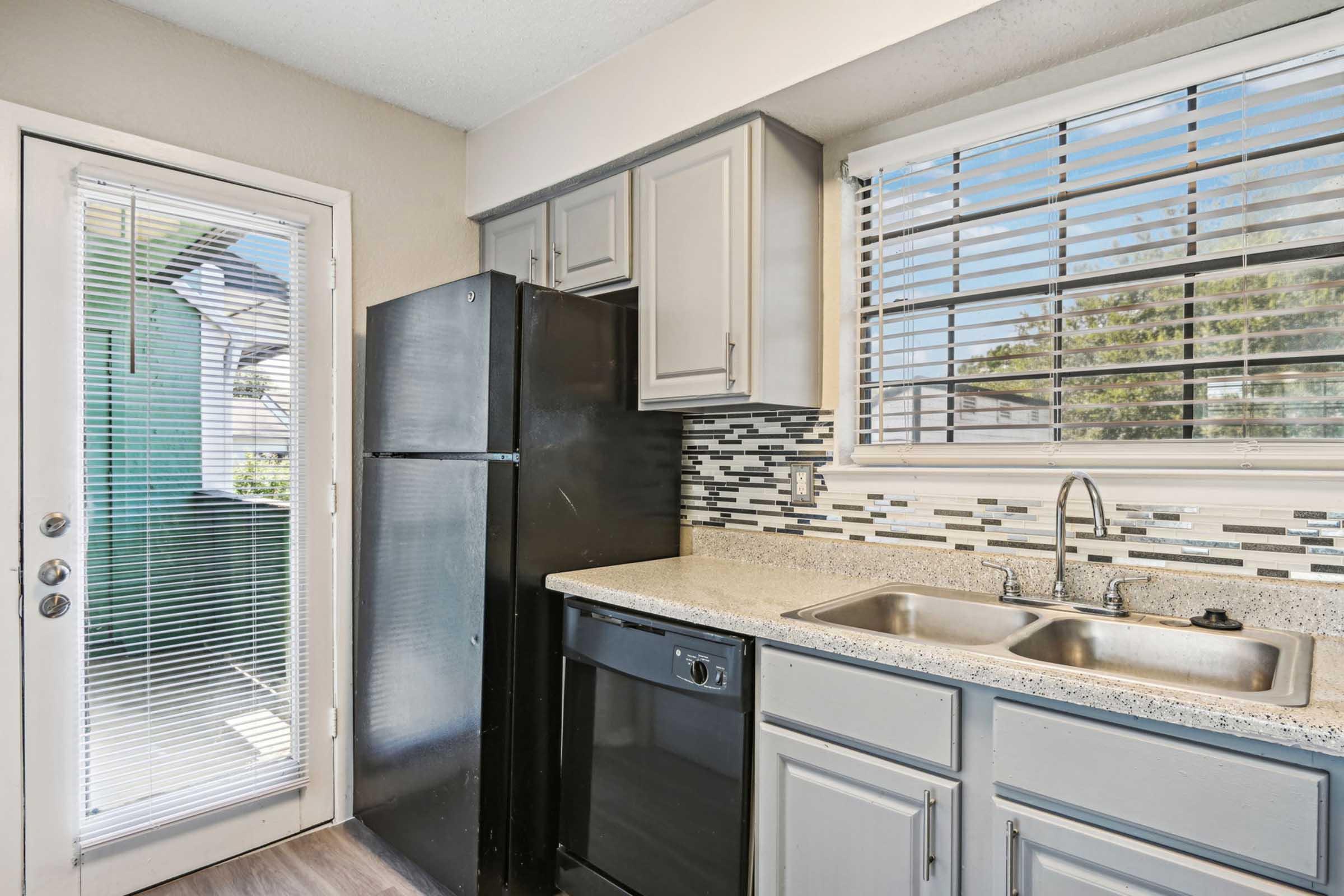 a modern kitchen with stainless steel appliances