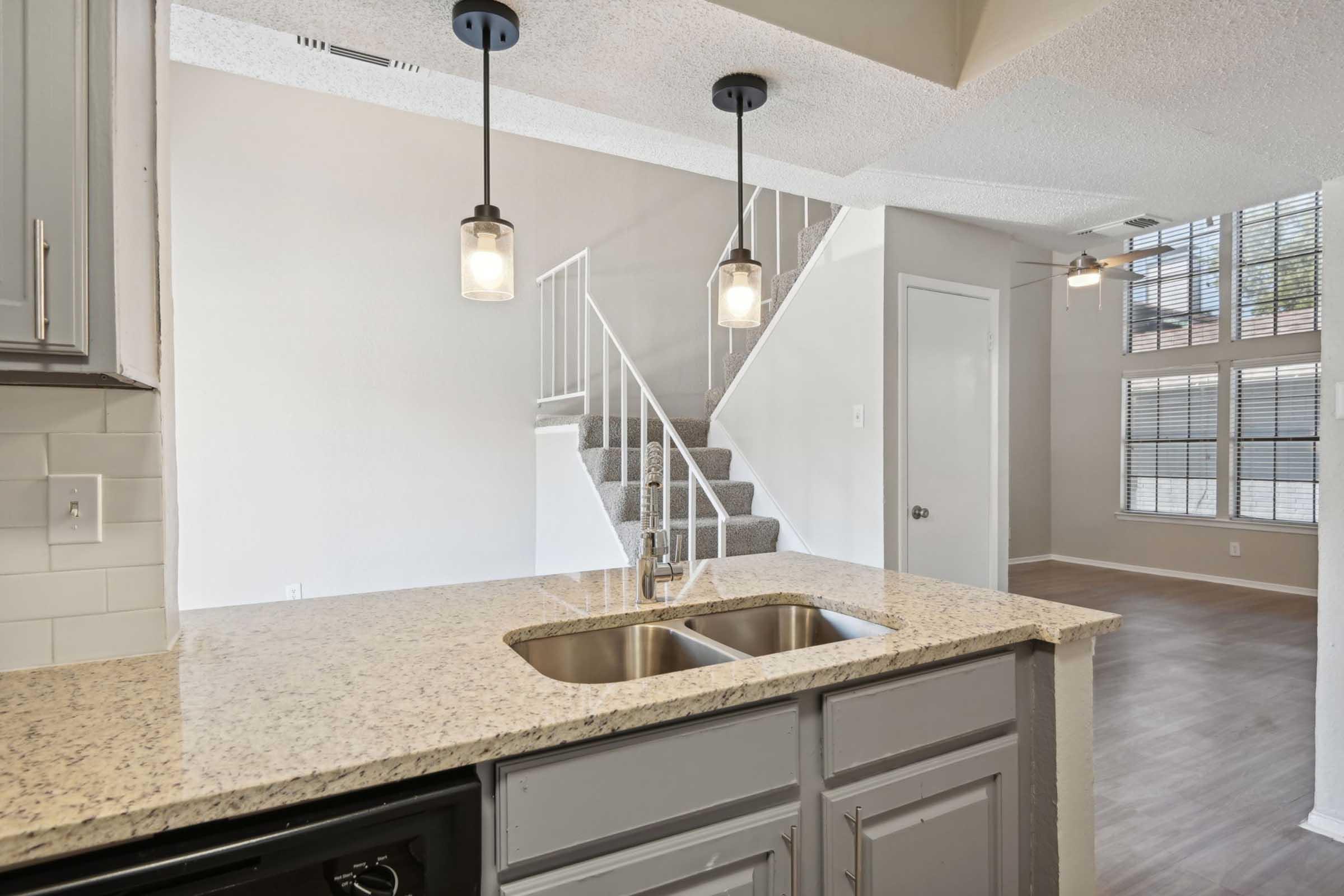 a kitchen with a sink and a window