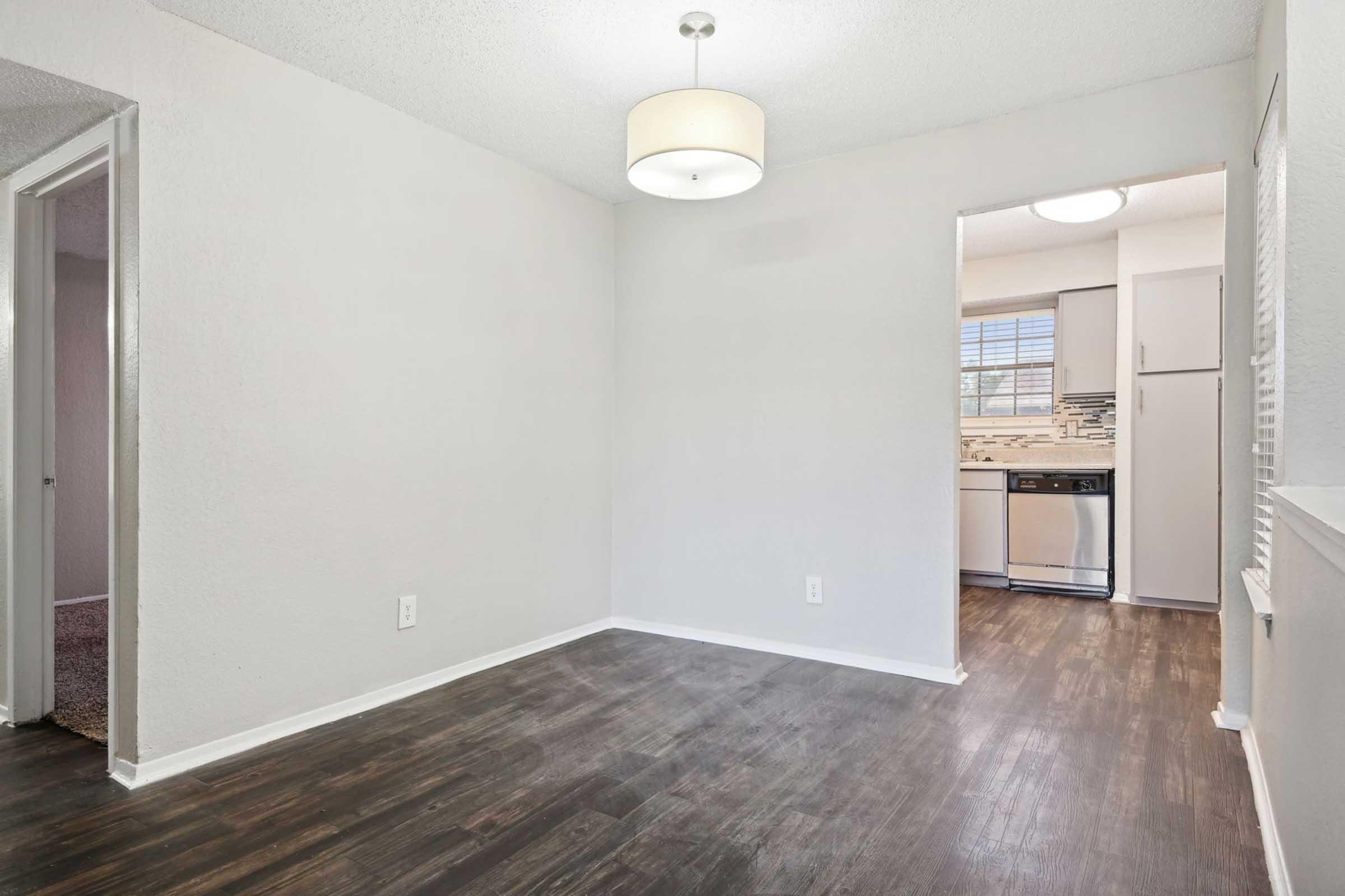 a kitchen with a wooden floor