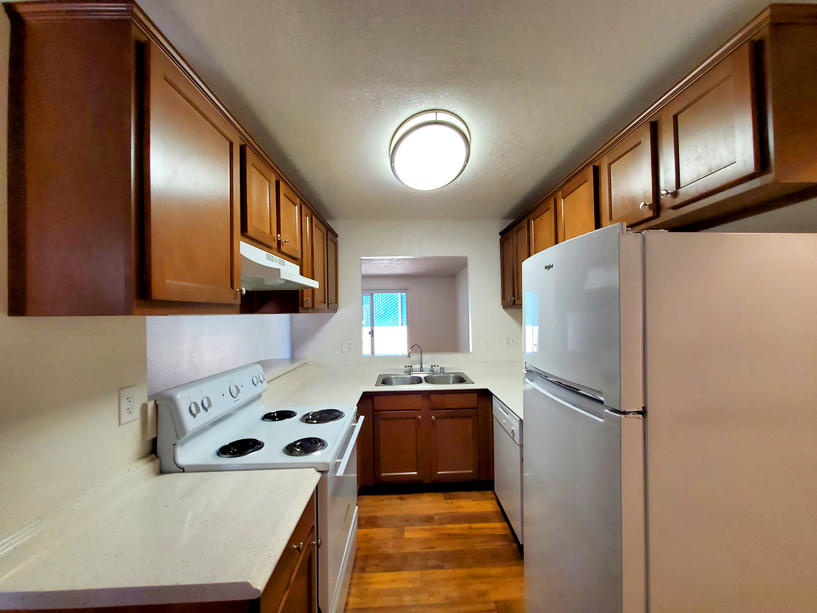 a kitchen with a wood floor