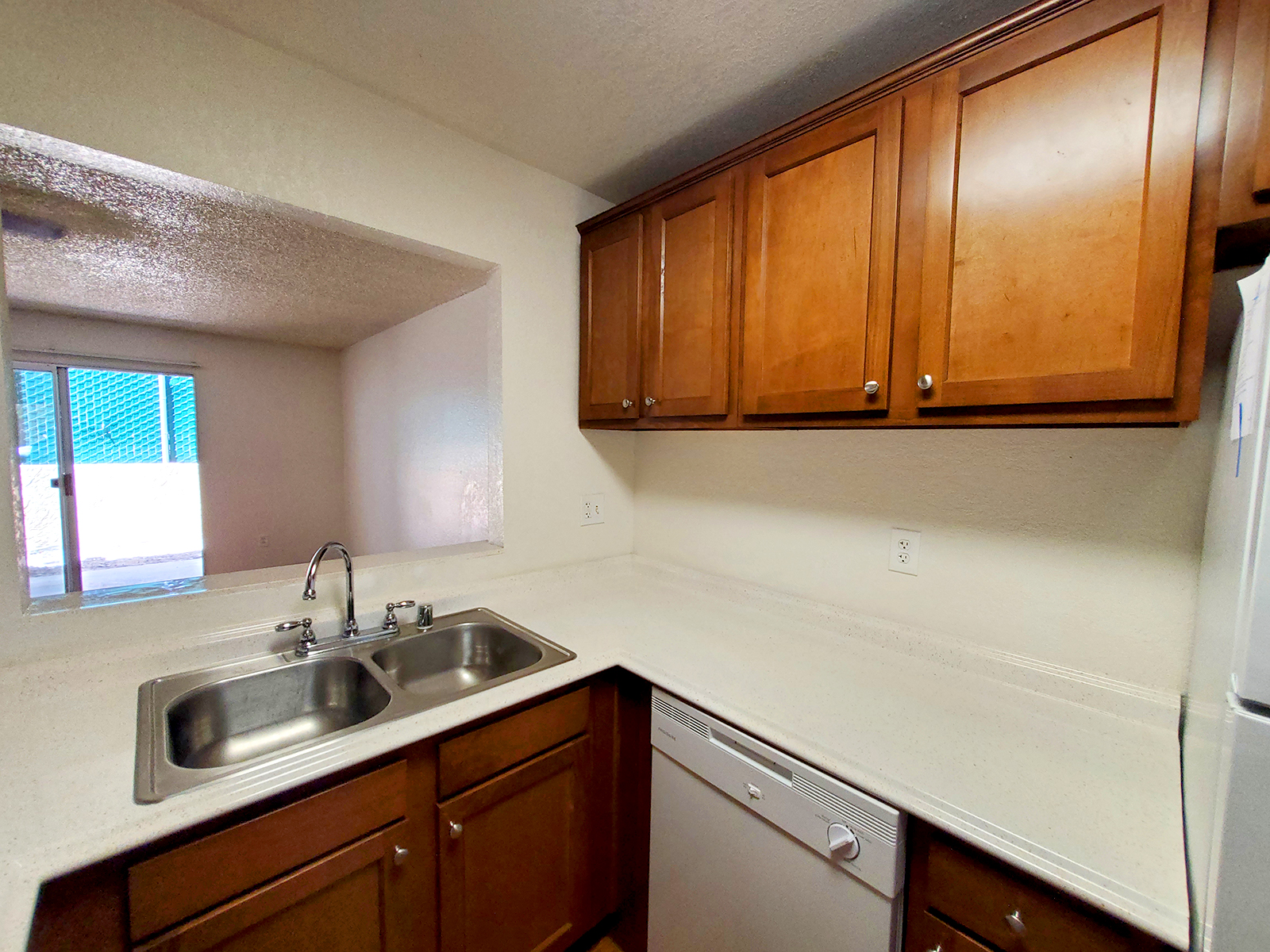 a kitchen with a sink and a microwave