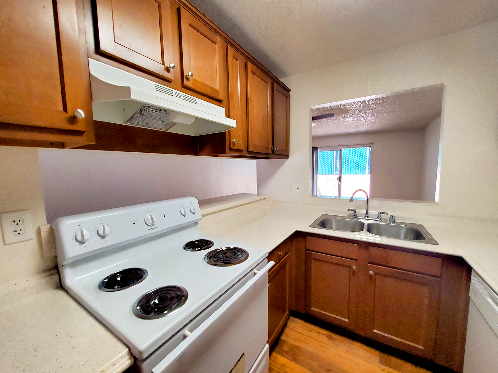 a stove top oven sitting inside of a kitchen