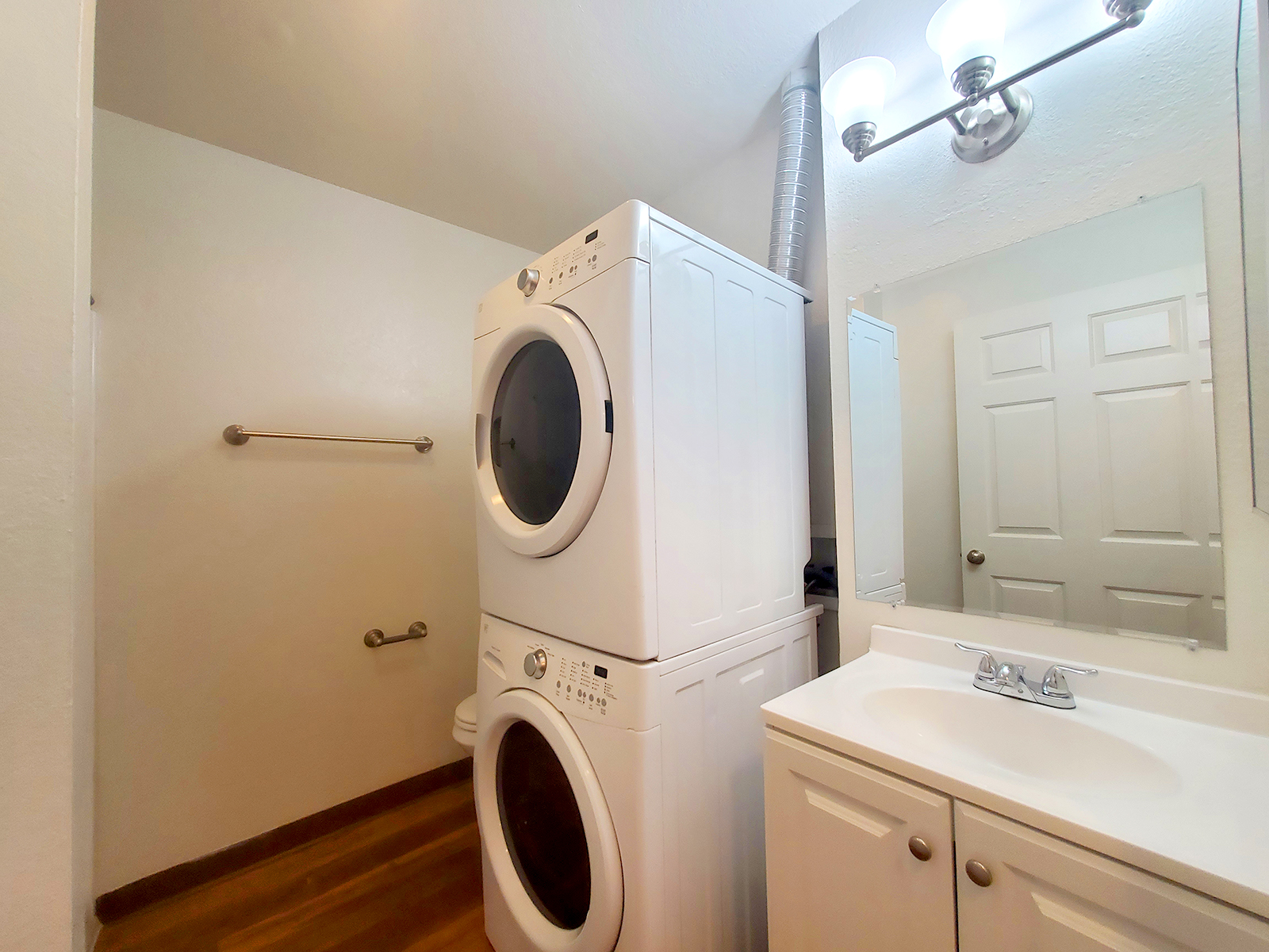 a kitchen with a sink and a mirror