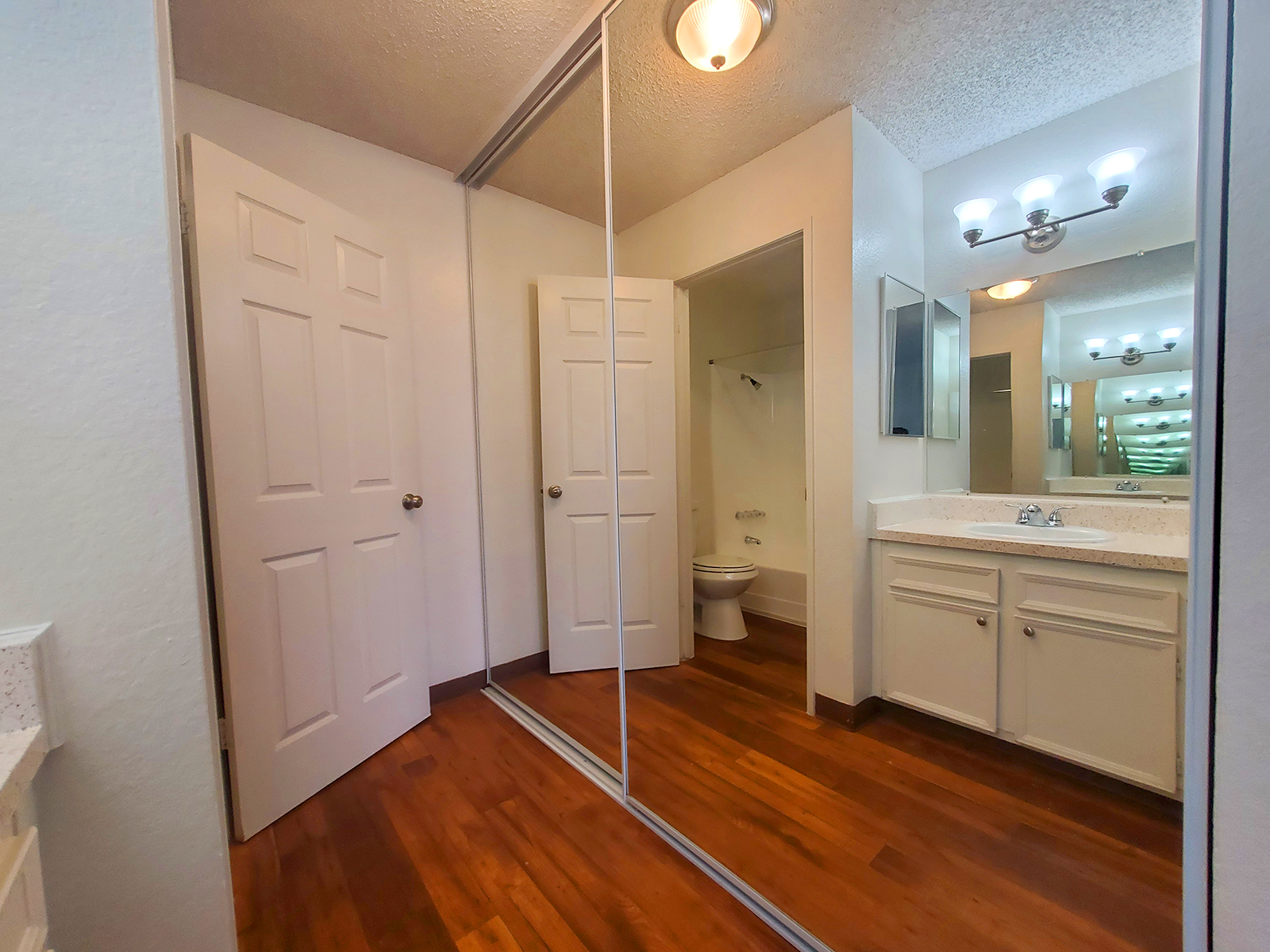 a kitchen with a wood floor