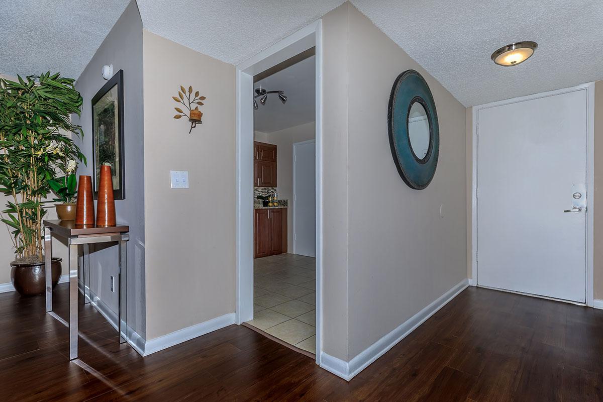 a view of a living room with a wood floor